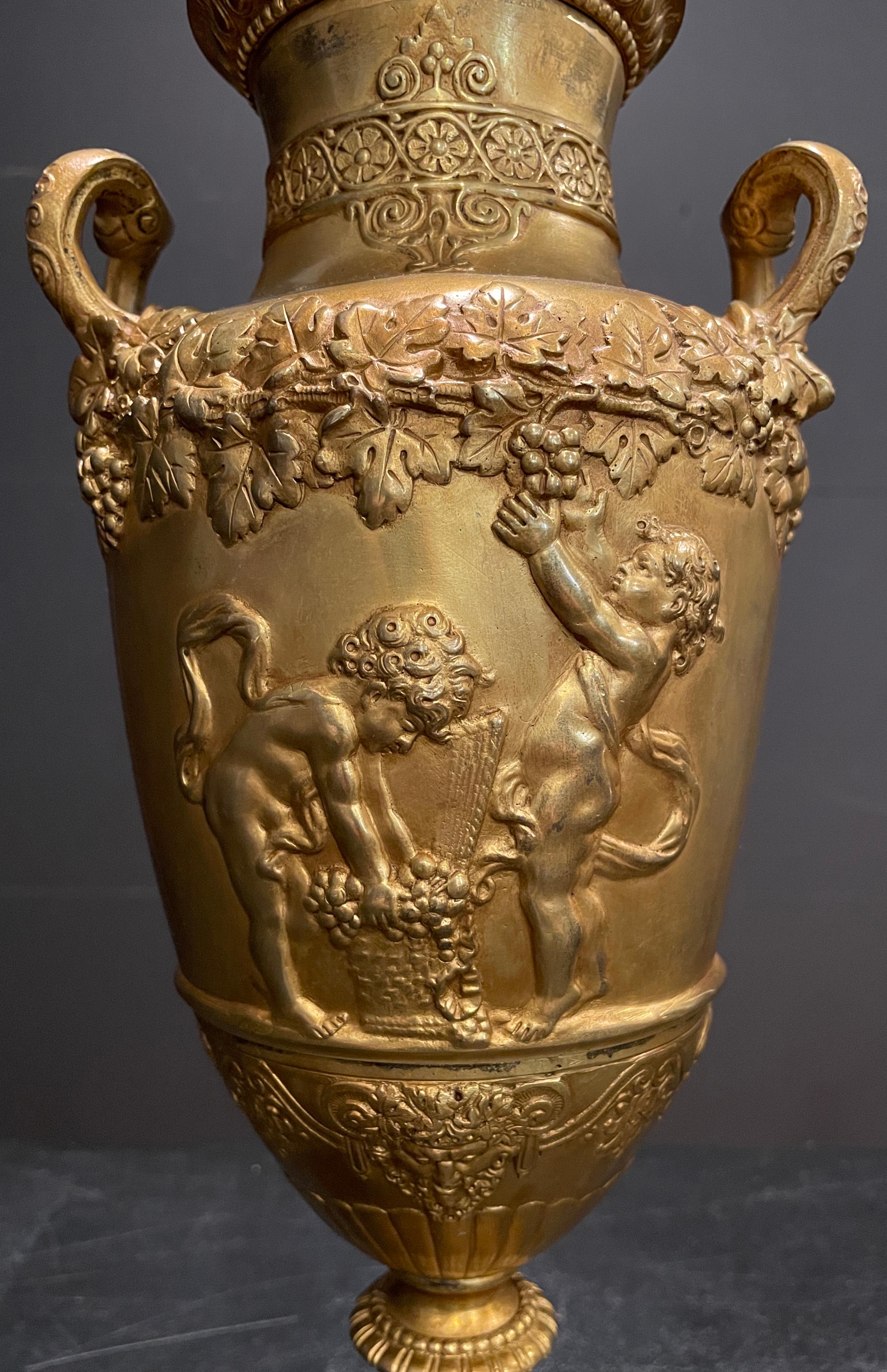 Neoclassical Pair of Gilt Urns as Lamps