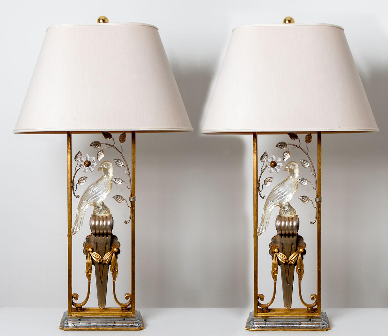 Double faced crystal parrot, crystal leaves with gilted metal frame and ornaments. Stunning table lamp holds two lights and still has its original lampshade that is replaceable with a shade of any shape. Attr to Maison Baguès, France.

The set is