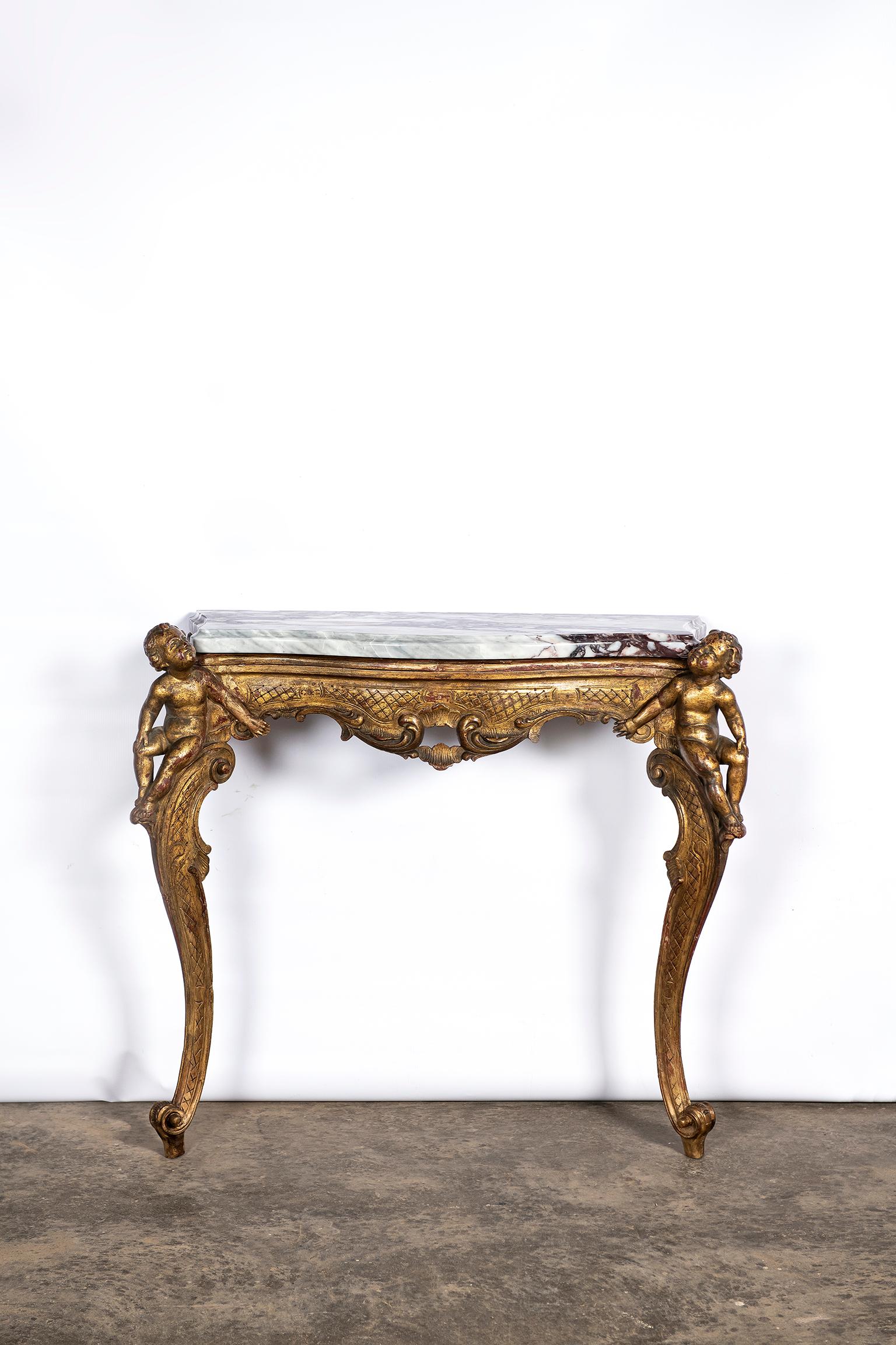 Pair of giltwood and breccia marble consoles, Italy, circa mid-19th century.