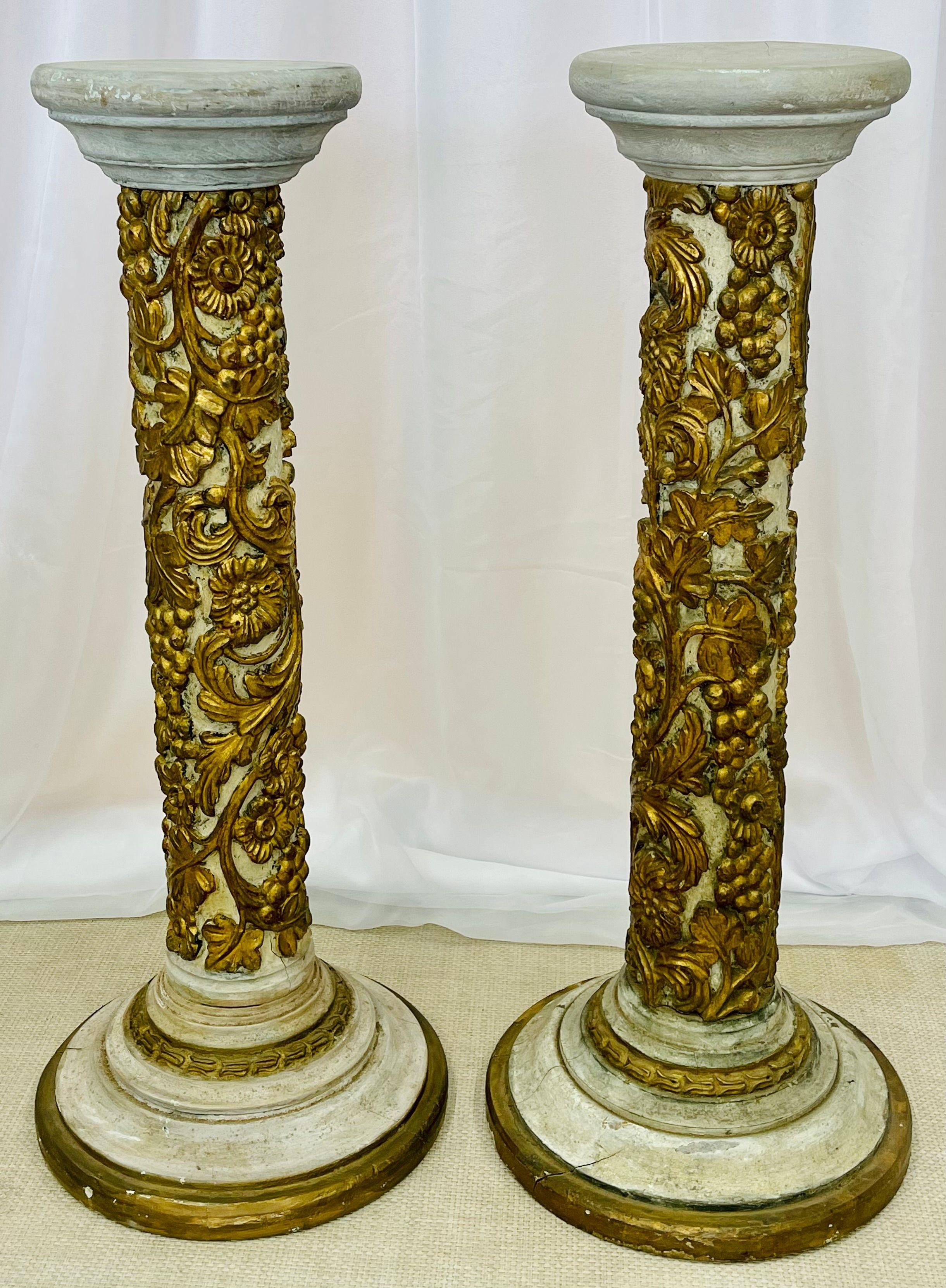Pair of Table Top Diminutive Decorative Giltwood and Paint Decorated Italian Columns, Gustavian Style, 19th Century Europe. This fine pair of painted and gilt wood columns or pedestals are simply spectacular. Each having all around hand carvings