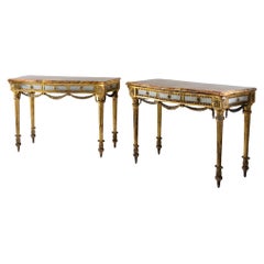 Pair of giltwood consoles with marble tops, 19th Century