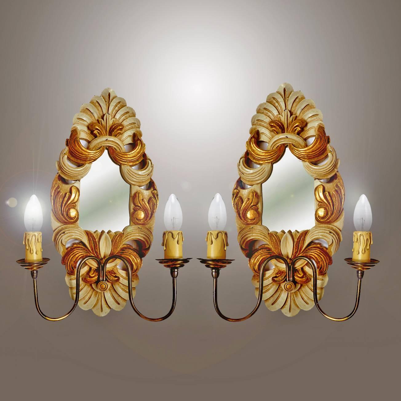 Antique 1950s pair of giltwood French double light mirrored back wall sconces or girandoles
Measures:
Height 17.71 in. (45 cm)
Width 11.81 in. (30 cm)
Depth 4.33 in. (11 cm)
Weight 4.5 lb. (2 kg).

