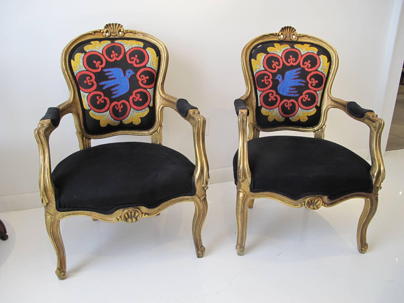 Pair of whimsical giltwood Louis XV style armchairs with stitched upholstery in the style of the Picasso dove.