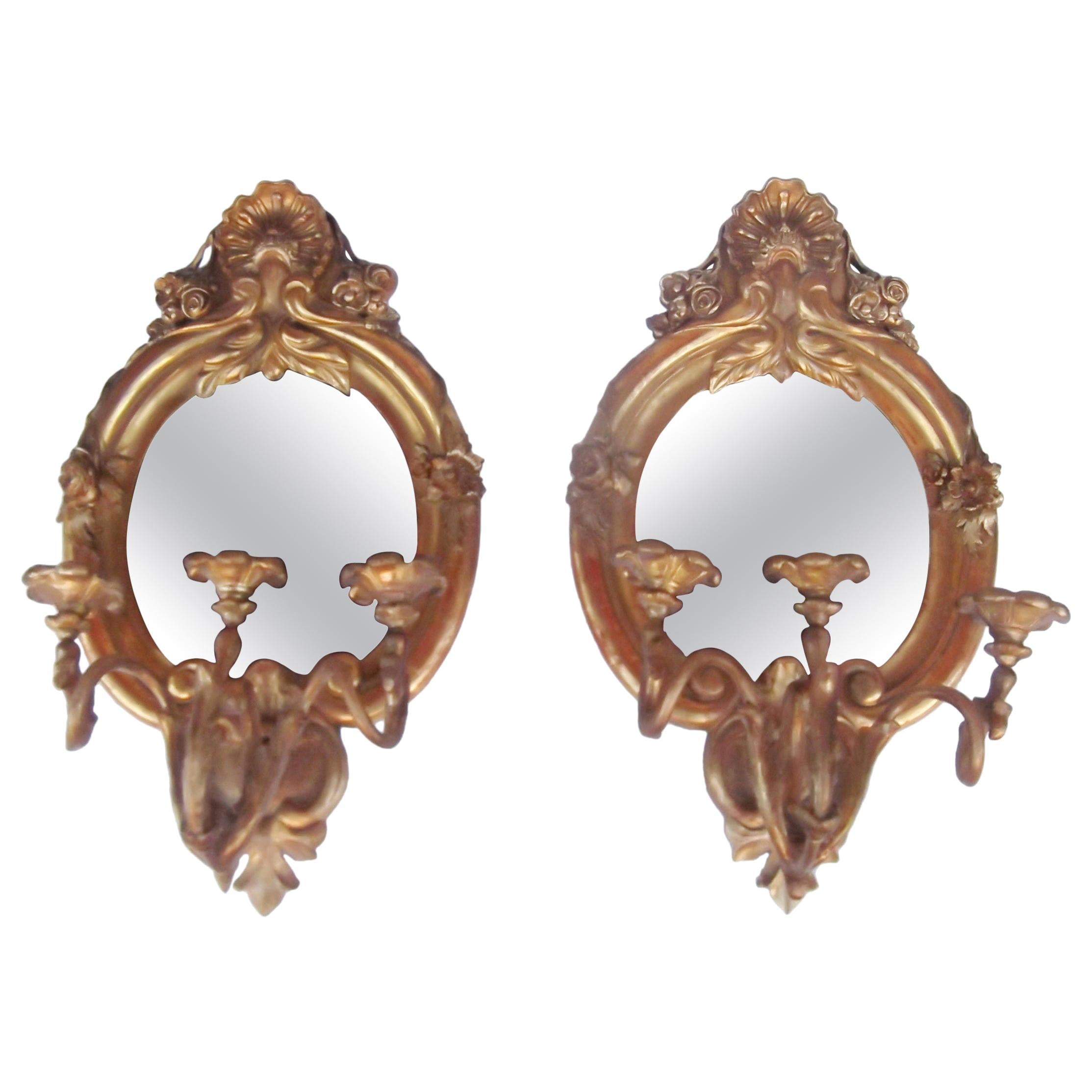 Paire de girandoles à miroirs en bois doré