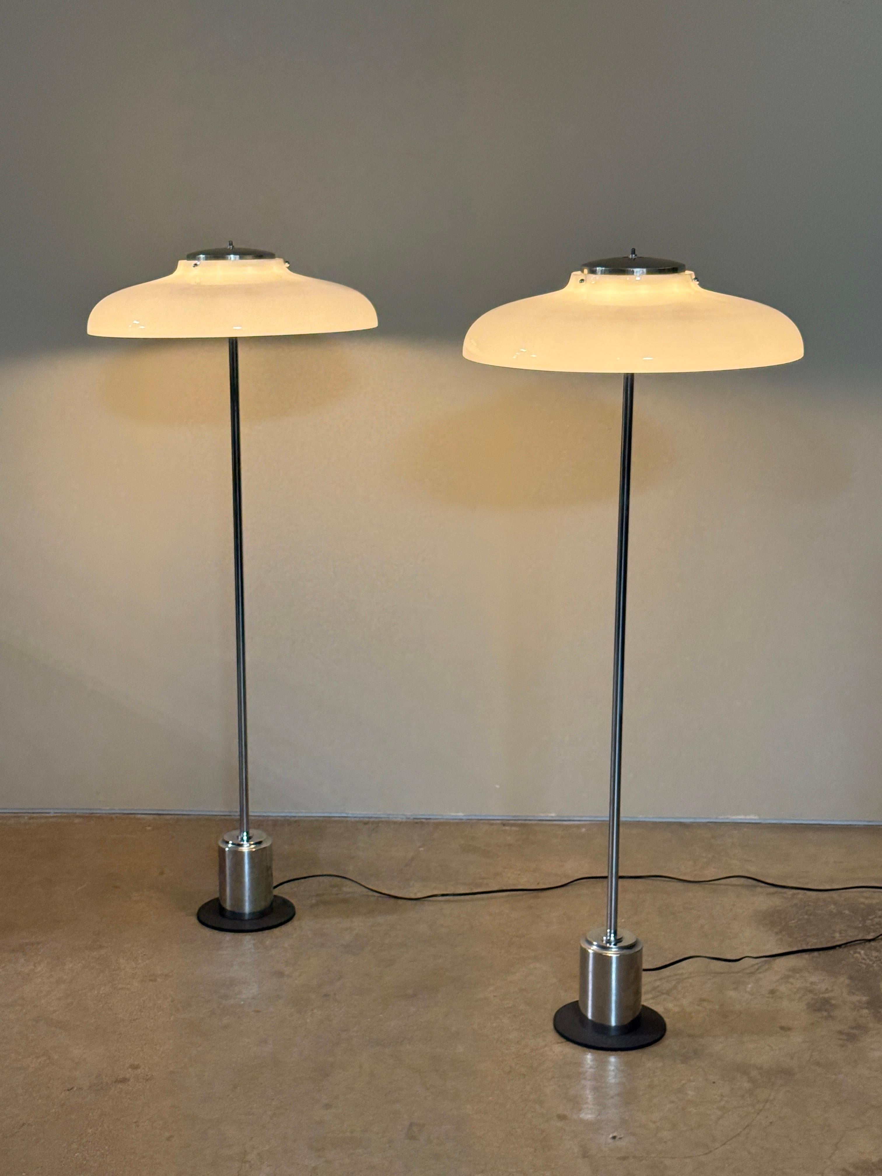 A rare pair of model 1005b floor lamps designed by Gino Sarfatti for Arteluce in 1963. Lamps have been rewired and each have six sockets. 

Literature; Gino Sarfatti 1938-1973 selected works Silvana Editoriale, Romanelli & Severi. Page 443.

 