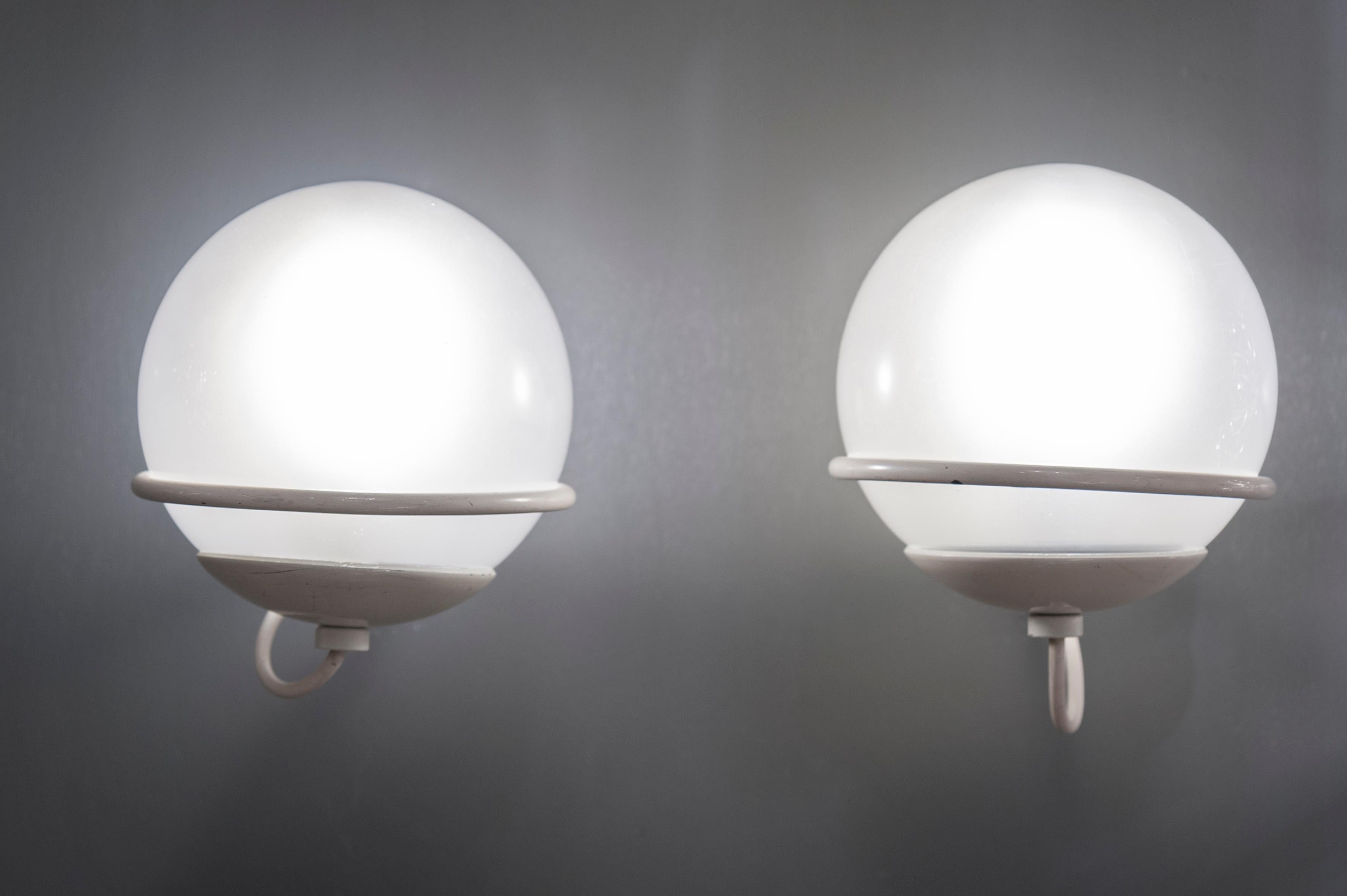 Pair of metal with frosted glass globes wall sconces by Gino Sarfatti for Arteluce, model 371/1, circa 1963.