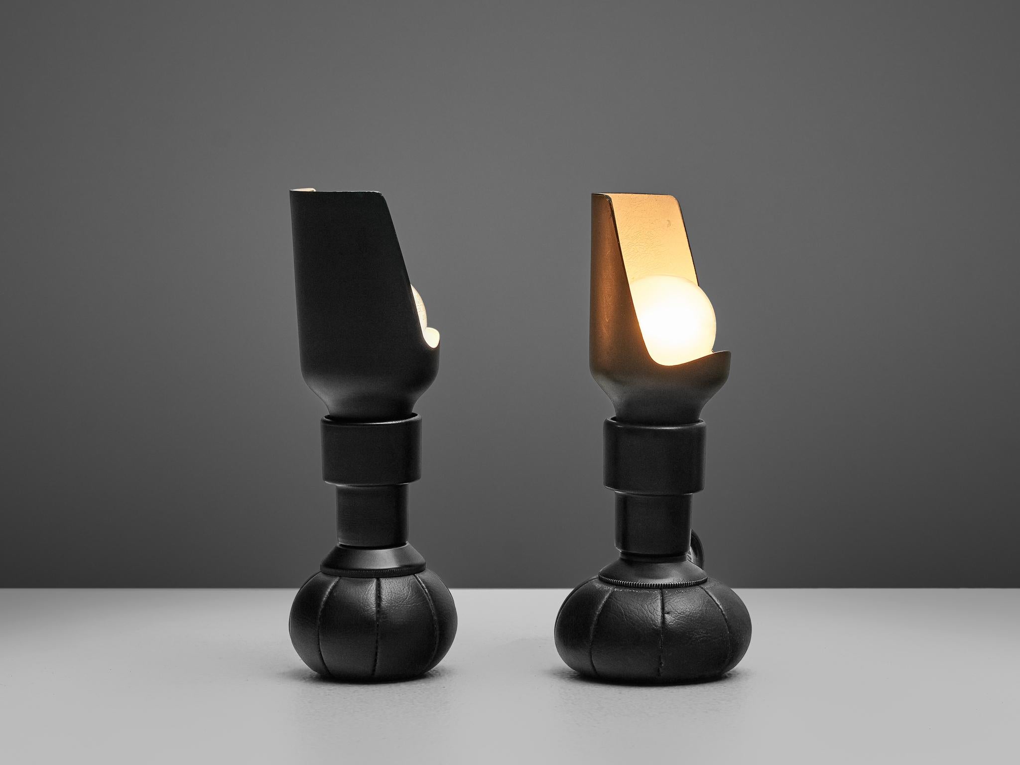 Gino Sarfatti for Arteluce, pair of model '600C' table lamps, black lacquered aluminum, black leather, Italy, 1966

A pair of exceptional lights by Gino Sarfatti for Arteluce. Weights at the bottom in shape of a round ball keep the lights in their