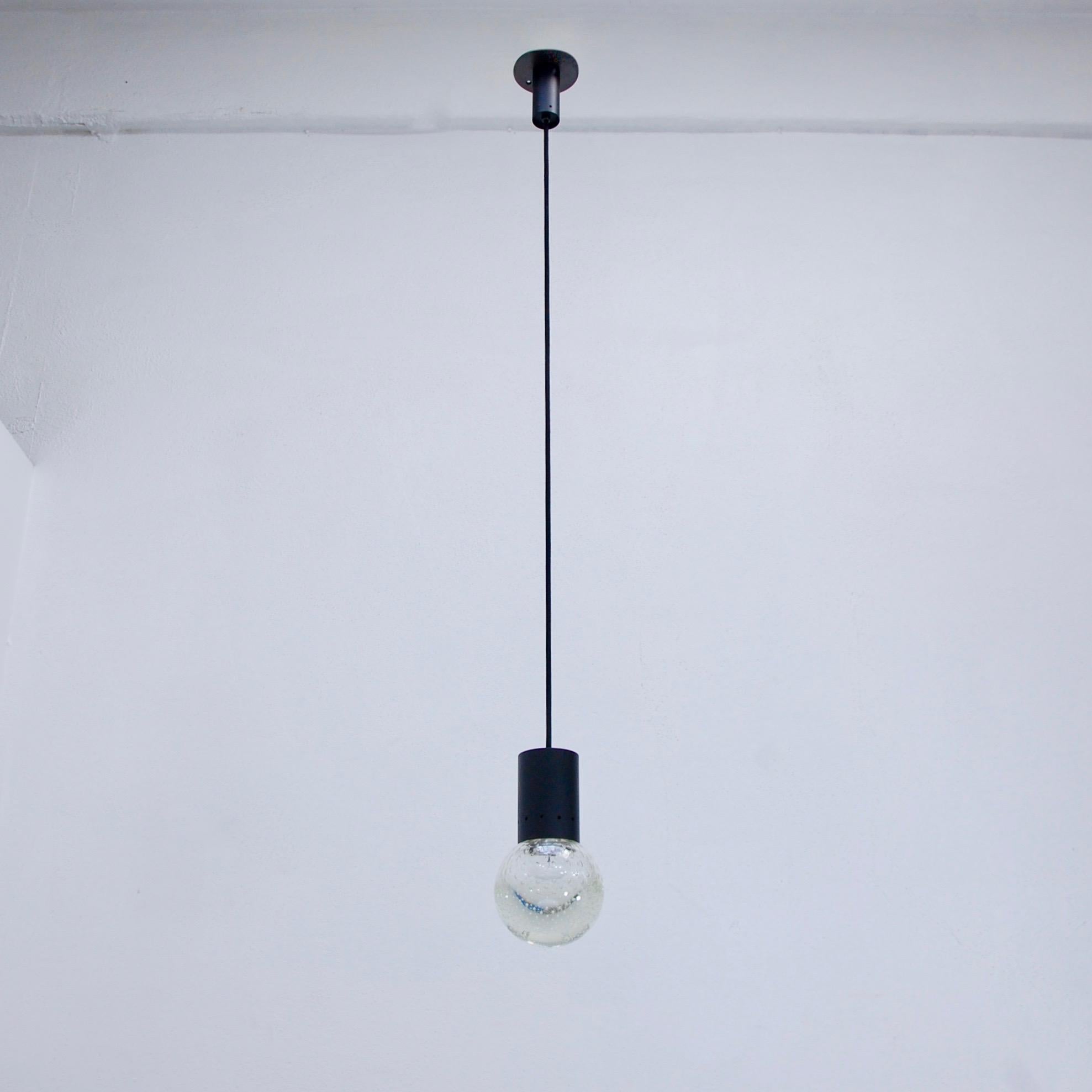 (2) Stunning pendants designed by the collaboration of Gino Sarfatti and Seguso from 1960s Italy. Elegant spherical bubbled Seguso glass, and black painted brass. Partially restored. Wired for the US with 2 E26 medium based socket per pendant. Light