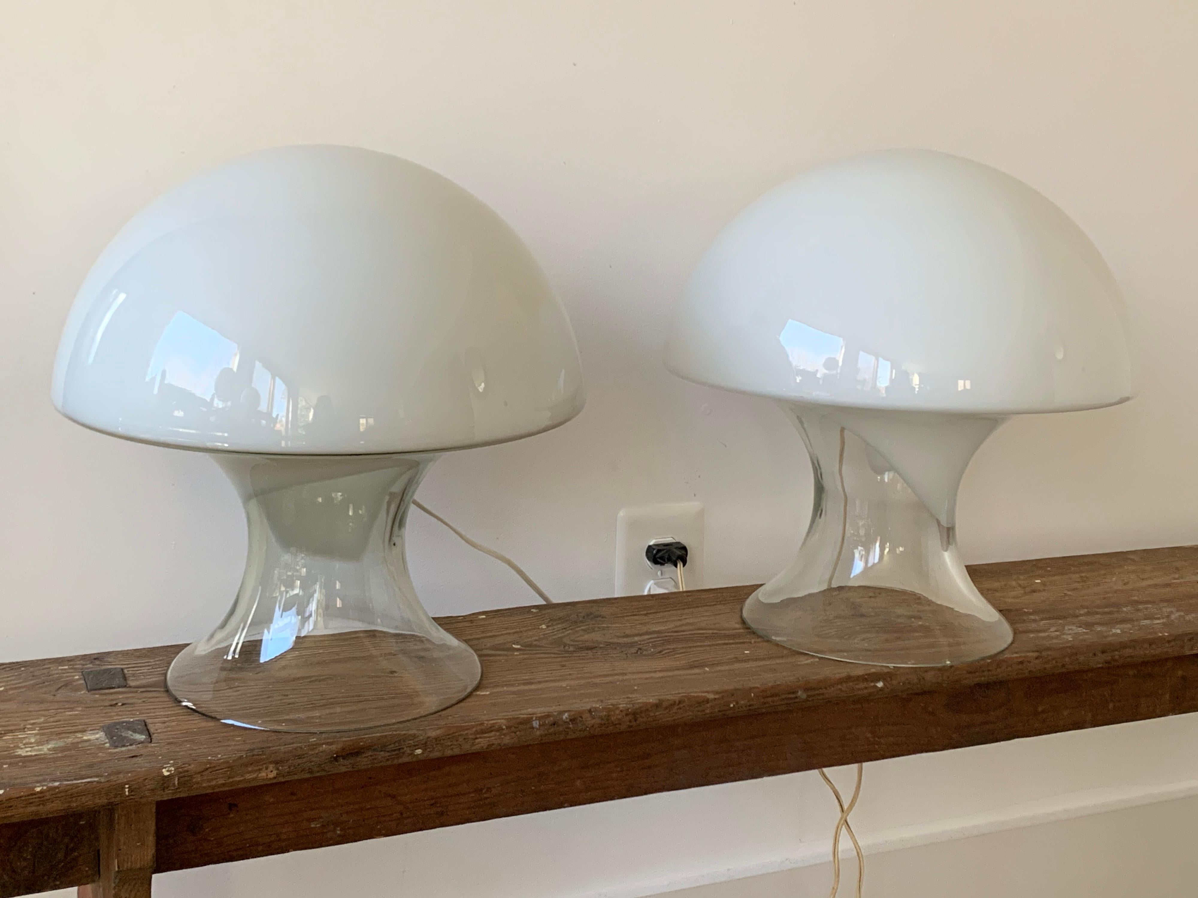 A pair of table lamps designed by Gino Vistosi, (1925-1980). Manufactured in Murano in the 1960s.
Clean glass with a white glass layer, as if a handkerchief were draped over the form. Each one is different, individual. Mushroom shaped.