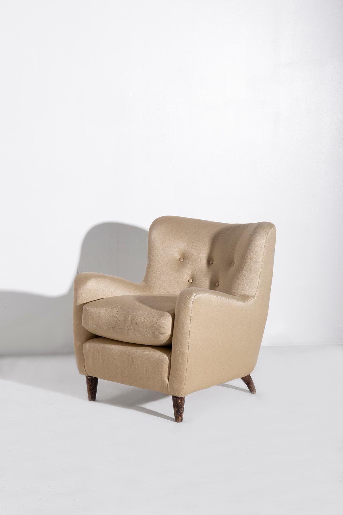Enter a world where the essence of 1940s Italian design takes center stage, embodied by a rare pair of armchairs designed by the legendary Giò Ponti for a naval project. These exceptional pieces were part of the furnishings aboard the illustrious