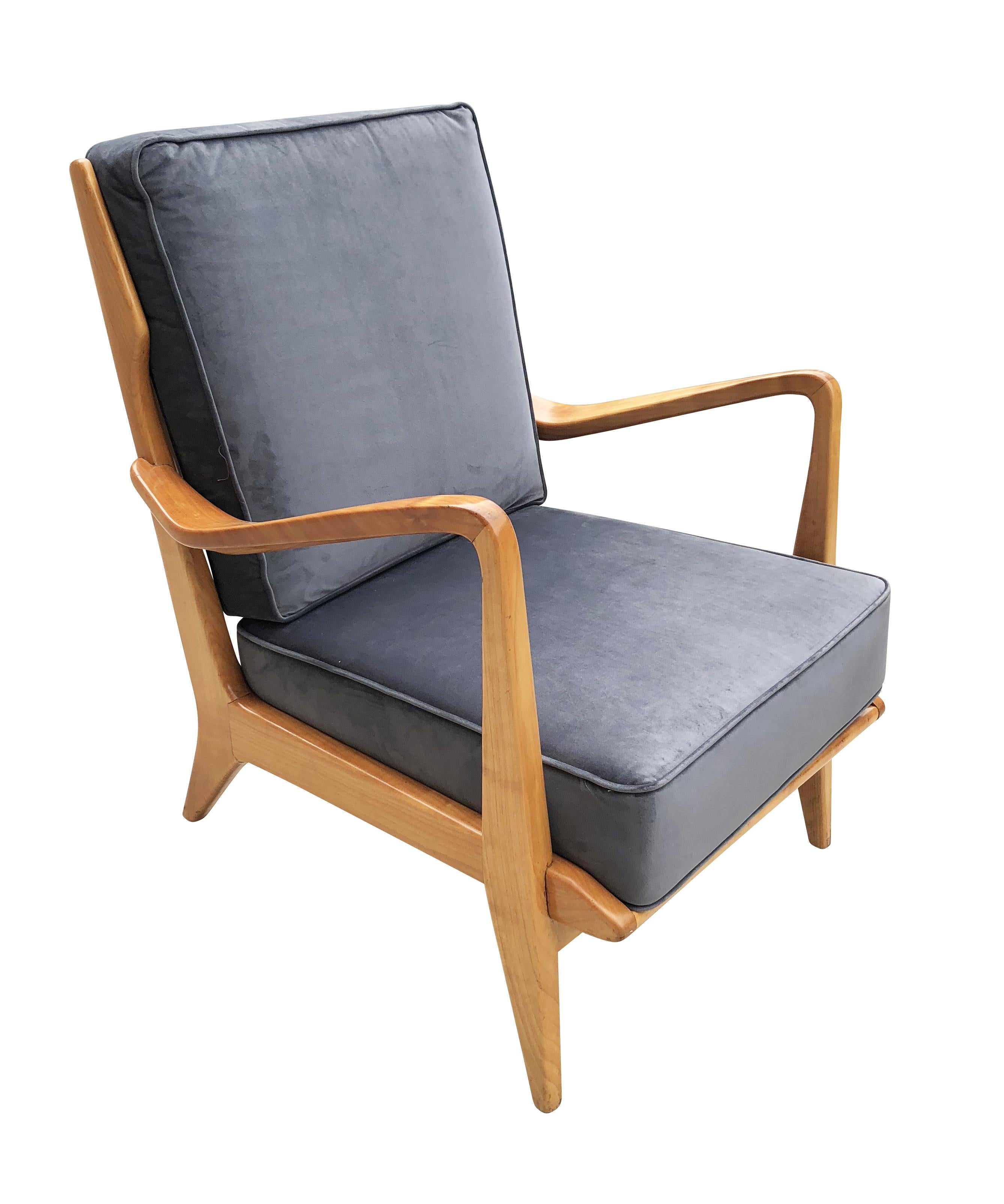 Pair of sculptural walnut armchairs, model 516, designed by Gio Ponti for Cassina in 1955. Ponti’s creativity can be seen in the many details including the rising open armrests, miniaturized wings and open back slats. Have been recovered in a blue