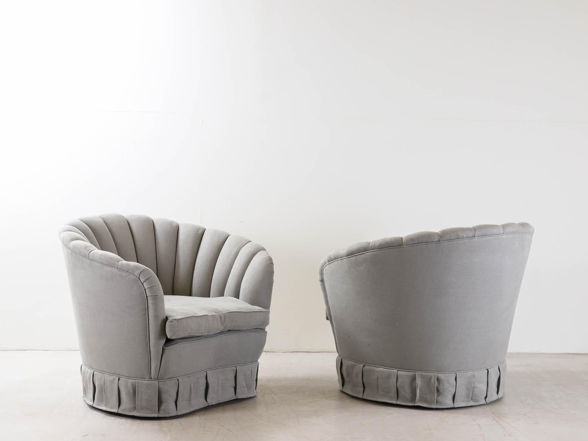 A pair of 1940s Gio Ponti shell chairs, reupholstered in a grey blue linen, retaining the original cushions and structure.

Giovanni 