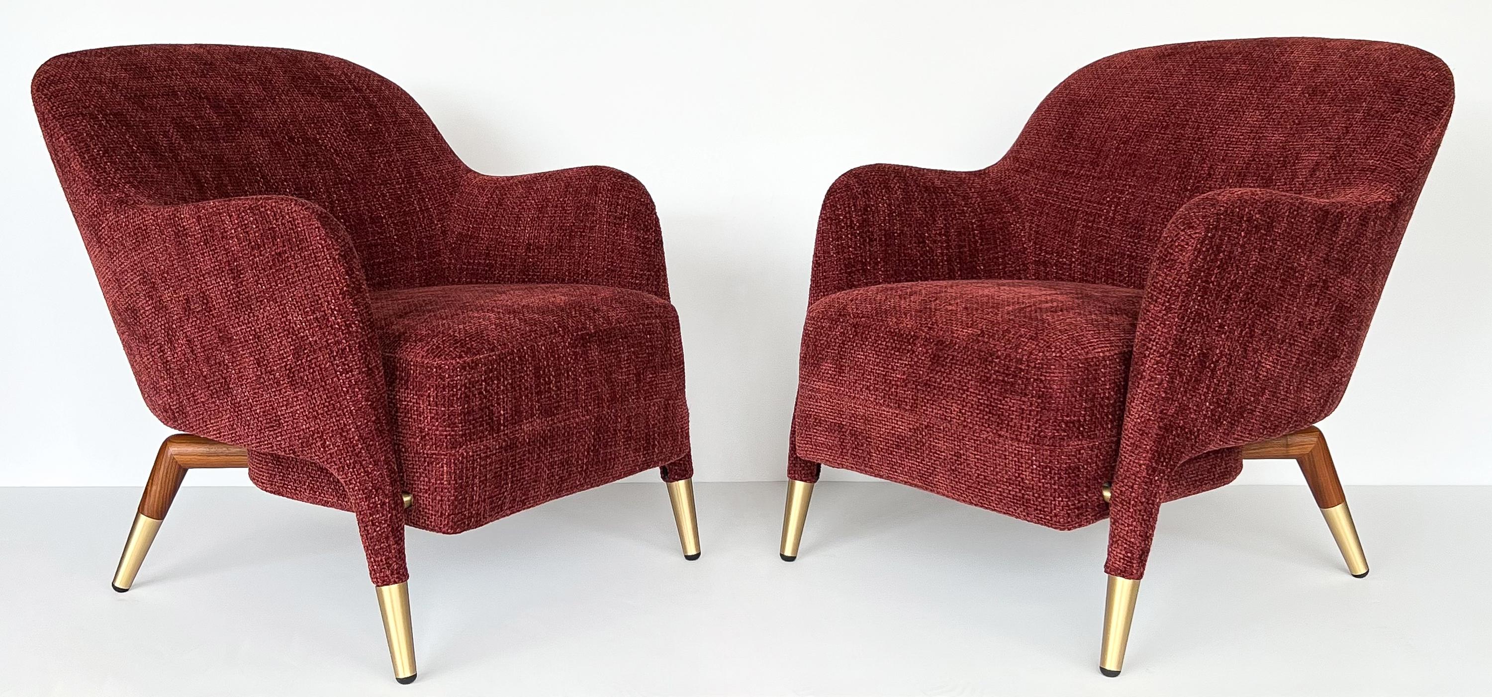 Pair of Gio Ponti model D.151.4 armchairs by Molteni &C, Italy circa 2020s. These sculptural lounge chairs are a new production and part of the Molteni & C Heritage Collection. Newly upholstered in a sophisticated maroon / merlot colored chenille