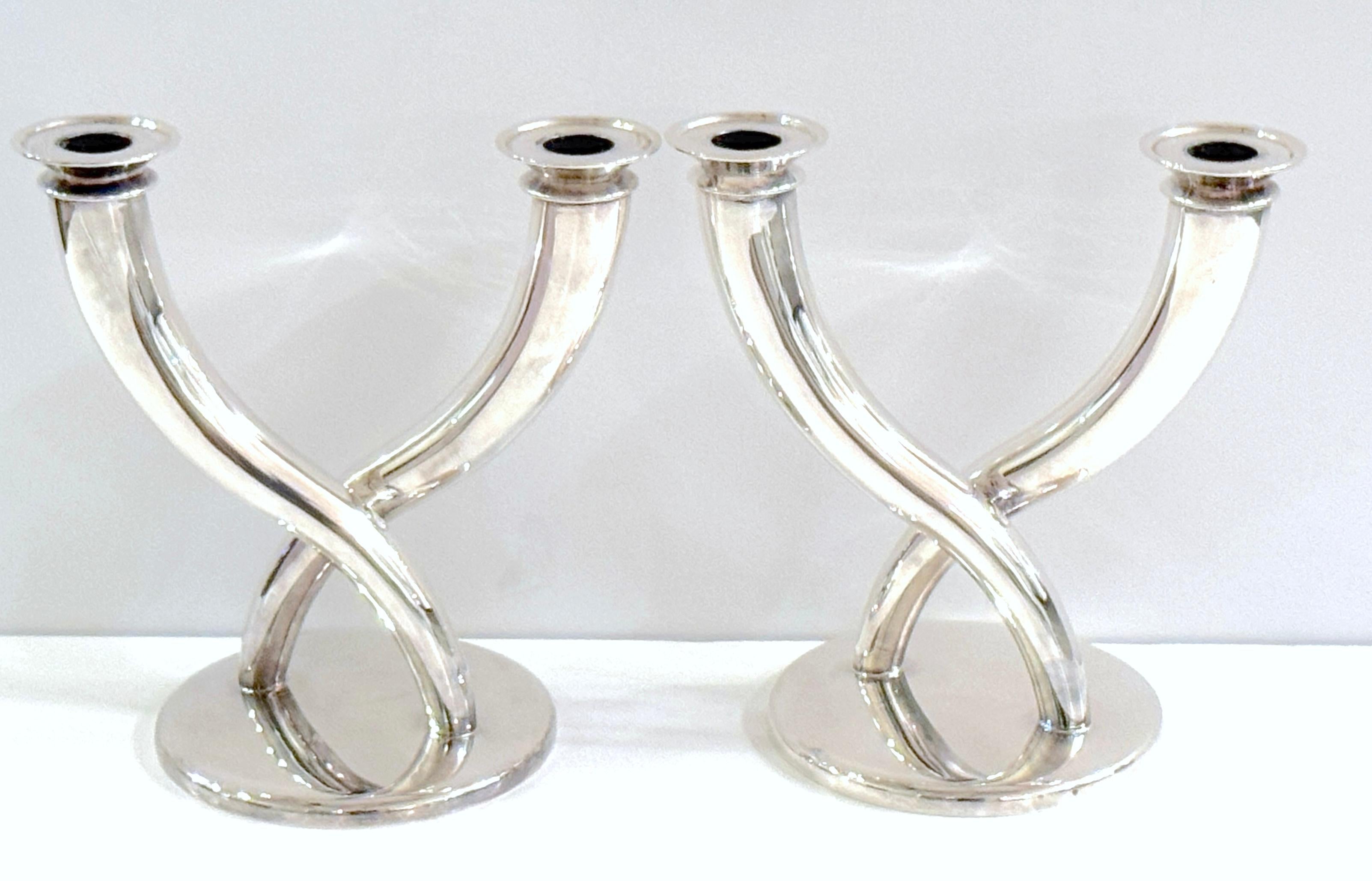 Pair of Gio Ponti Silverplated Candelabra for Christofle 

Italy/France, design circa 1935, these examples executed late 20th century 

a superb pair of silver-plated candelabra designed by Gio Ponti for Christofle, Italy/France, circa 1935, with