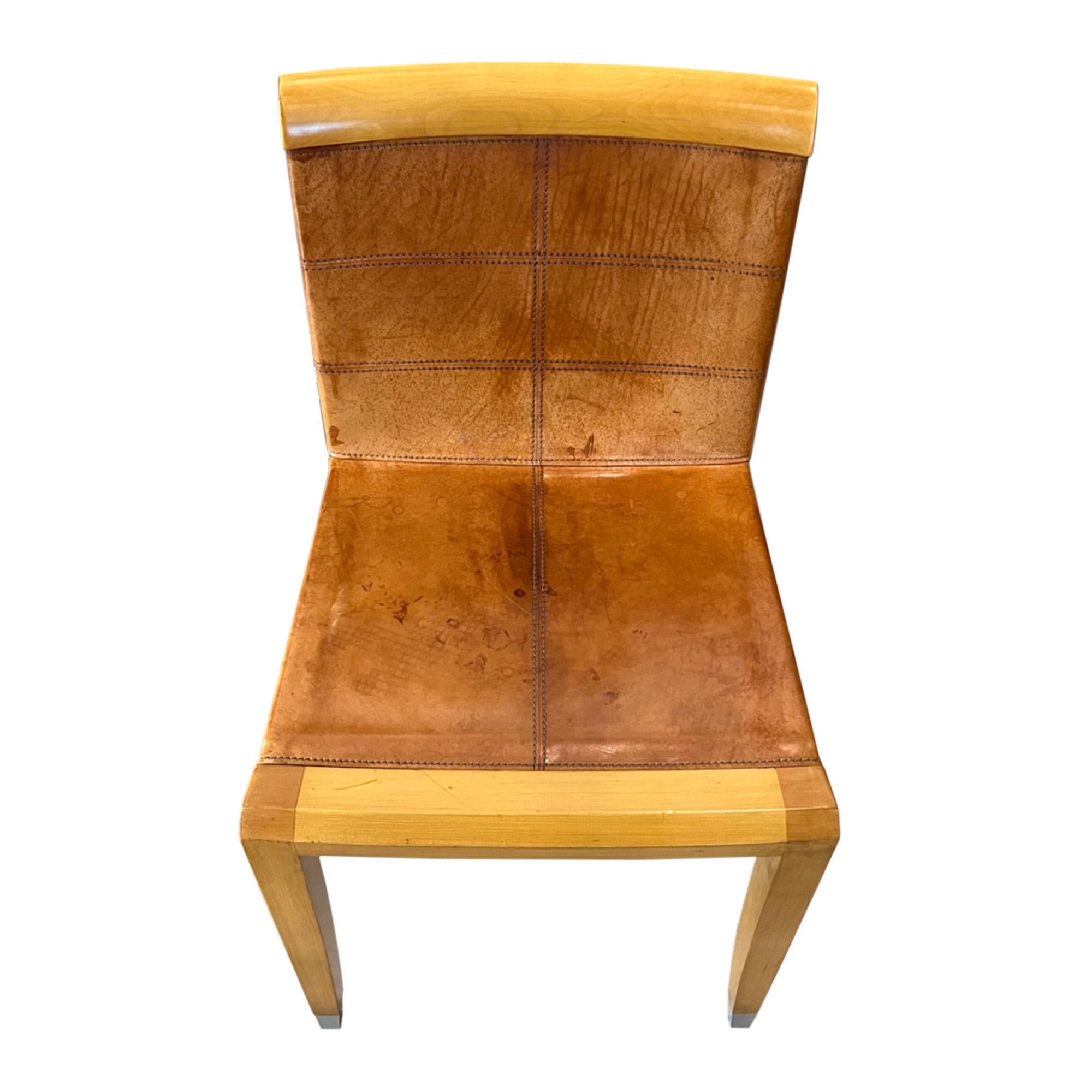 This attractive pair of dining chairs were made by the first class furniture manufacturer Giorgetti Italia and designed by Chi Wing Lo. They are beech wood upholstered in tan leather with exquisite stitching.

Some wear and patina - please take a