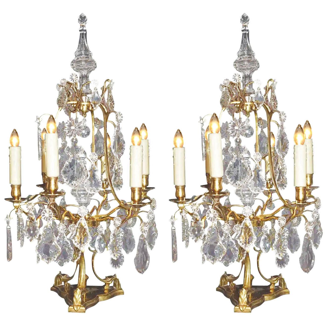 Pair of gilt bronze and crystal six-light girandoles.