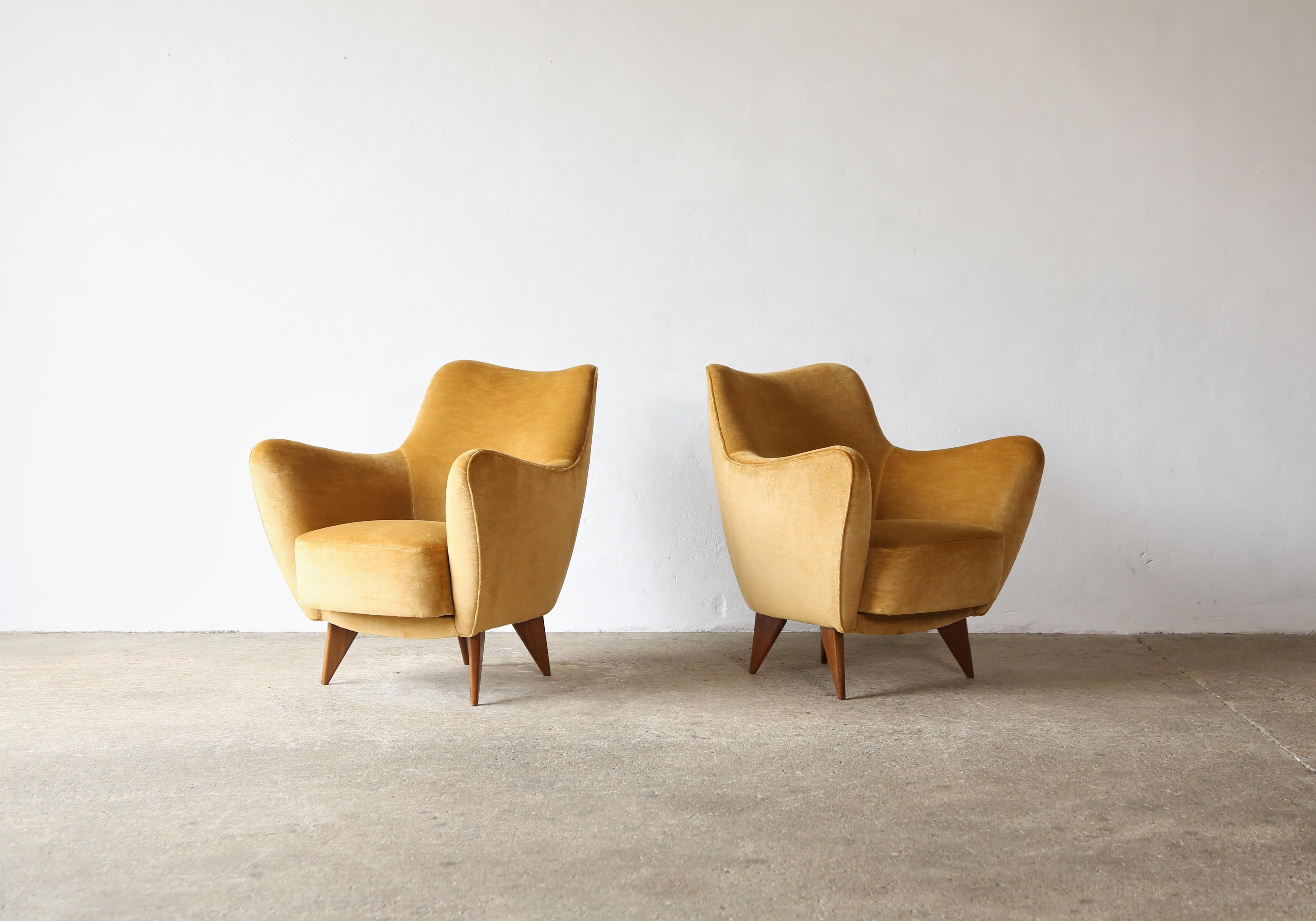 A lovely pair of Giulia Veronesi Perla armchairs, I.S.A. Bergamo, Italy, 1950s.   Newly upholstered in a textured golden yellow velvet.   Fast shipping worldwide.

