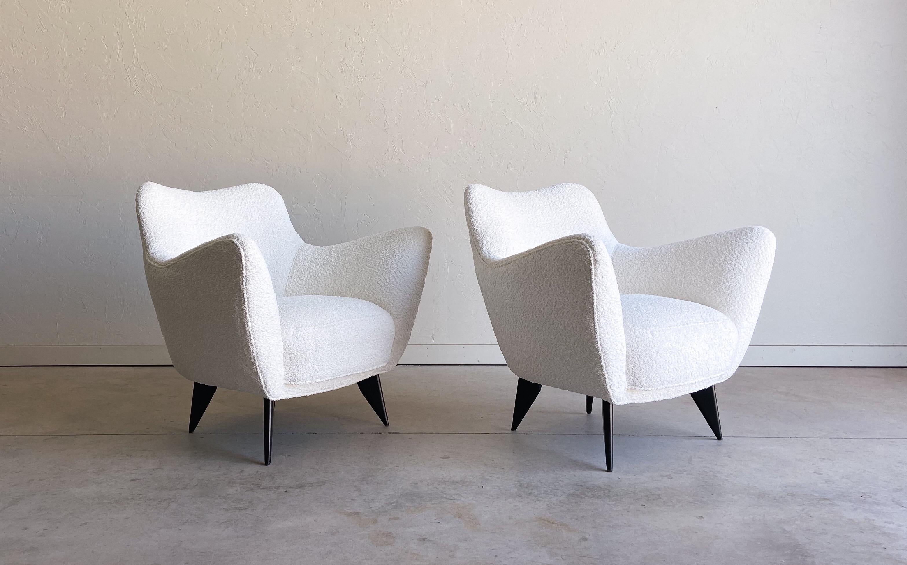 A lovely and rare pair of organic lounge chairs or armchairs designed by Giulia Veronesi. Produced by ISA Bergamo in the 1950’s. 

These chairs feature a wonderful organic design that is as much art as it is function. These are quite comfortable.