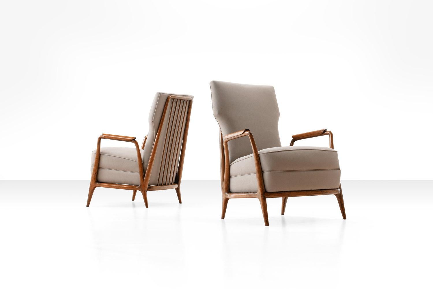 Pair of Giuseppe Scapinelli high back chairs in Caviuna wood, Brazil, 1950s

This pair of two high back armchairs has the typical Scapinelli style with its curvy lines and soft sensual shapes. The elegant lines of this design are beautifully