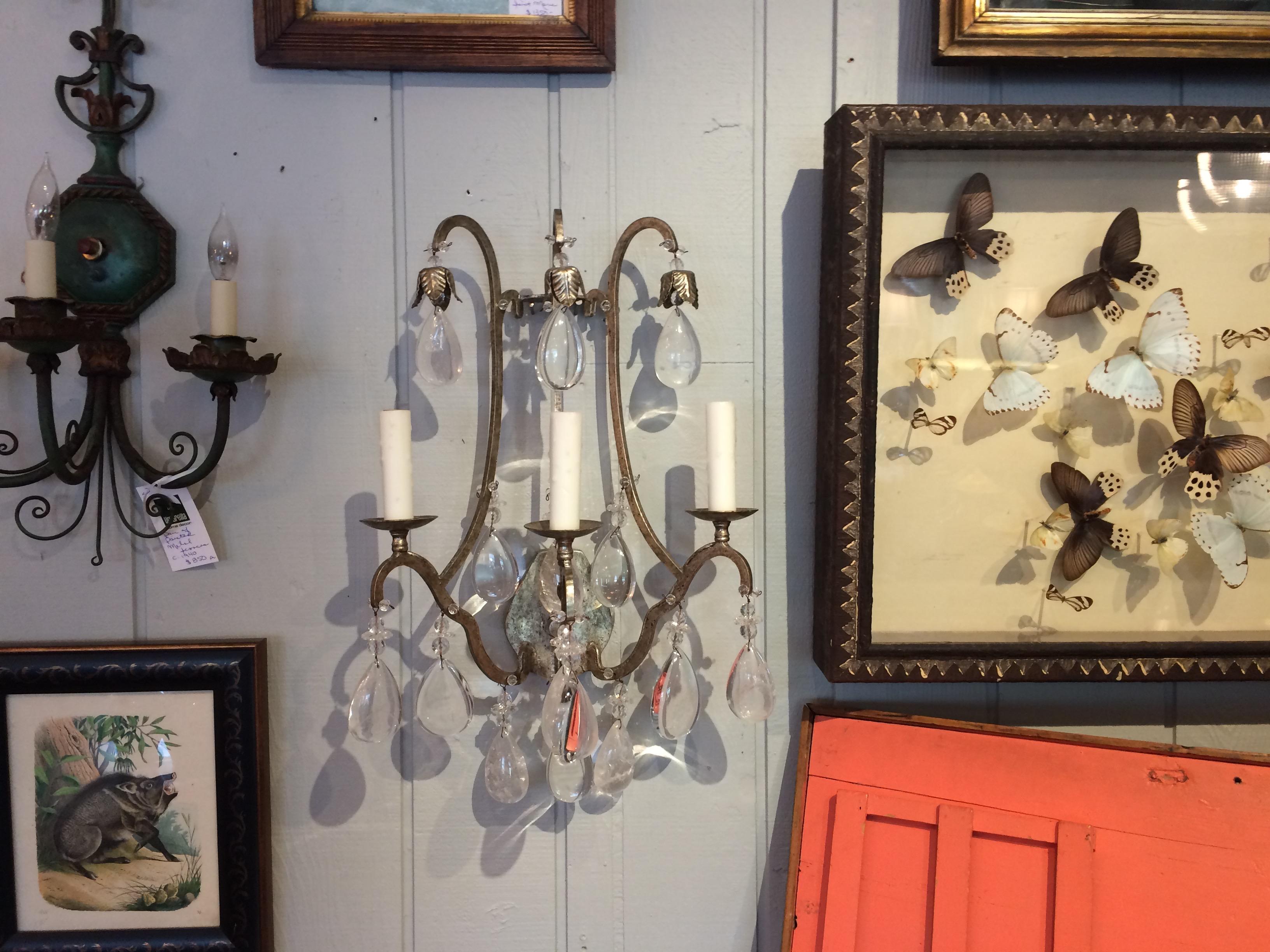 Two super impressive large silvergilt iron sconces with chunky tear shaped rock crystals and three candlestick arms.