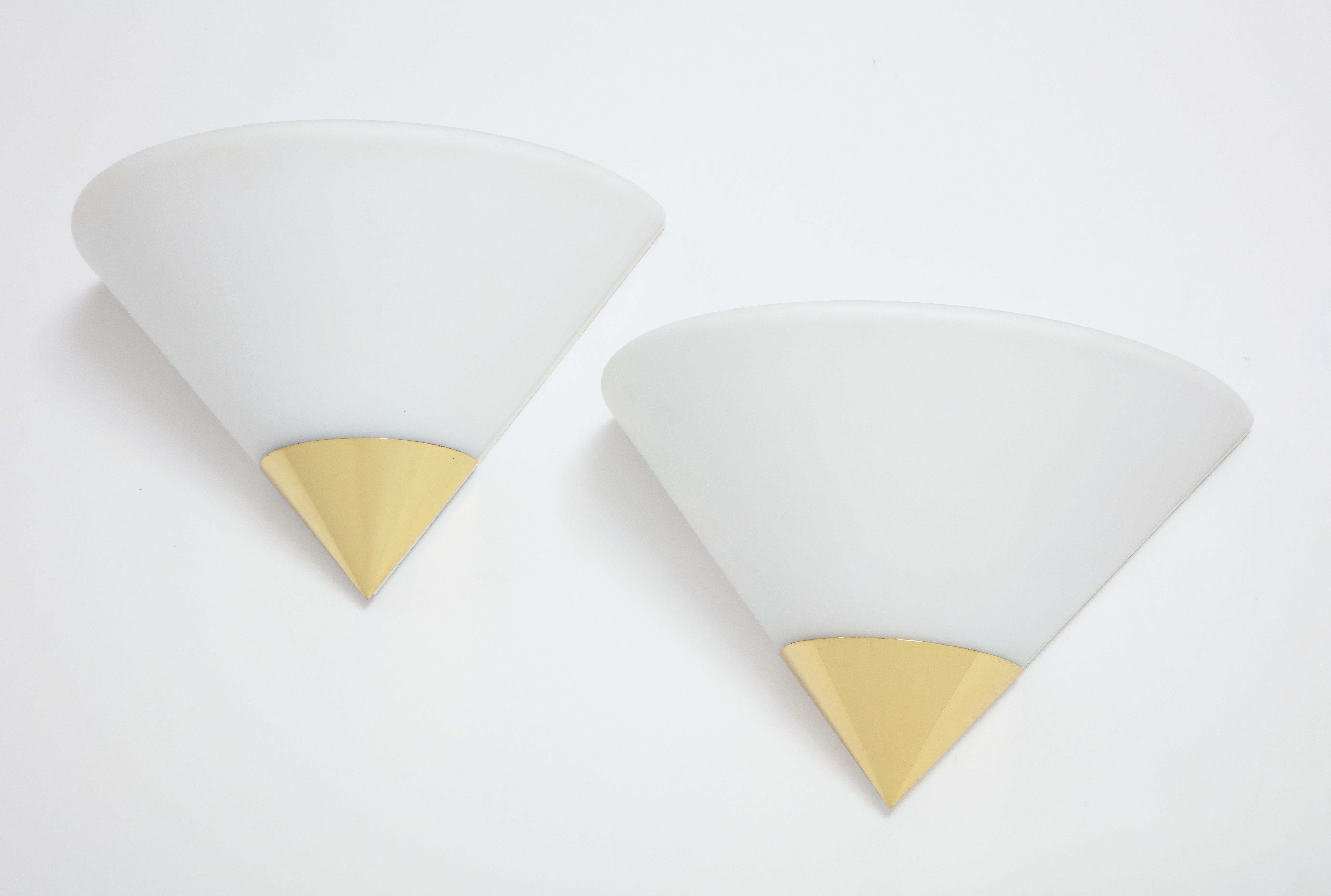 Pair of opaline glass and brass demilune sconces by Limburg.
The glass sits into a polished brass CAP and white back plate.
The sconces each have a single standard socket which have been
Newly rewired for the US with a 60 Watt maximum.
 