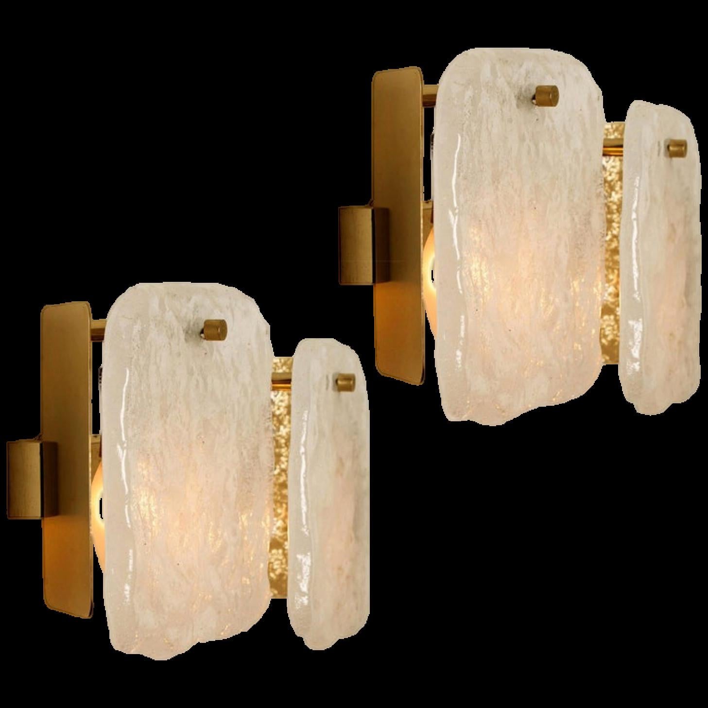 A stunning pair of light fixtures designed by J.T Kalmar, manufactured by Kalmar Franken, Austria in the 1960s.
High-end and handmade design from the 20th century. The large squares of white, opaque textured glass shades provides a nicely diffuse