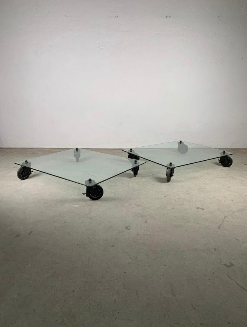 Pair of low tables by Gae Aulenti for Fontana Arte, 1970s 
Iconic pair of low tables with wheels, glass top and painted metal forks. Gae Aulenti for Fontana Arte.

Good condition, signs of time visible in photo.

Write us for further information
I