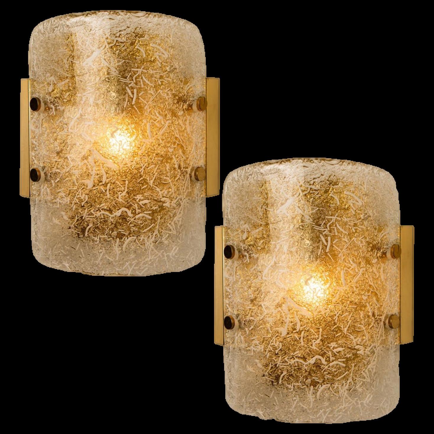 Pair high-ended structured ice glass wall sconces by Hillebrand, designed by Hillebrand and produced by Hillebrand, manufactured in circa 1970 (late 1960s and early 1970s). Each wall fixture is made from brass and it features one thick marbled