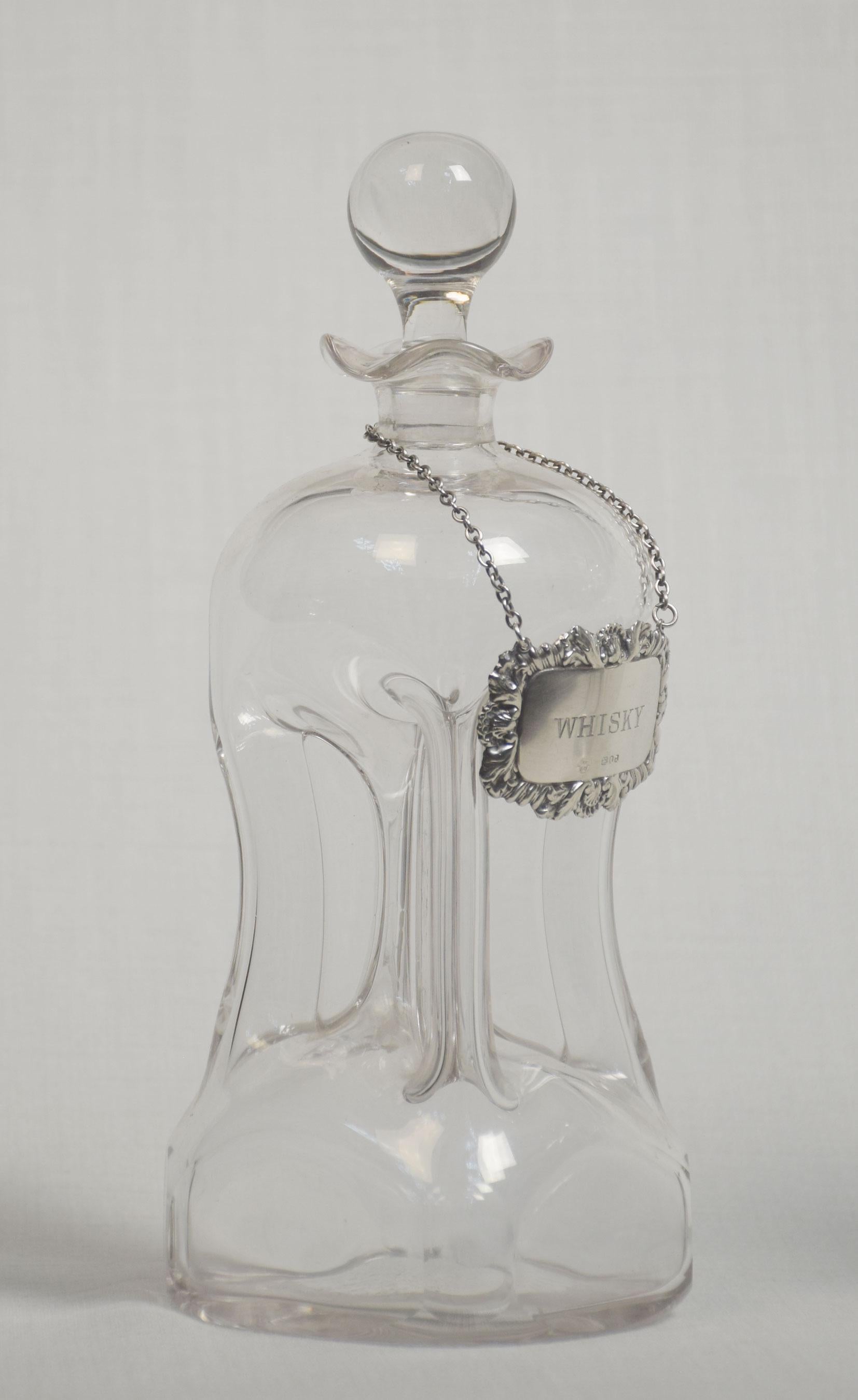 Pair of glass decanters with stoppers and each with a Birmingham silver ‘Whisky’ decanter label.
Dimensions
Height 9.5 Inches
Width 4 Inches
Depth 4 Inches