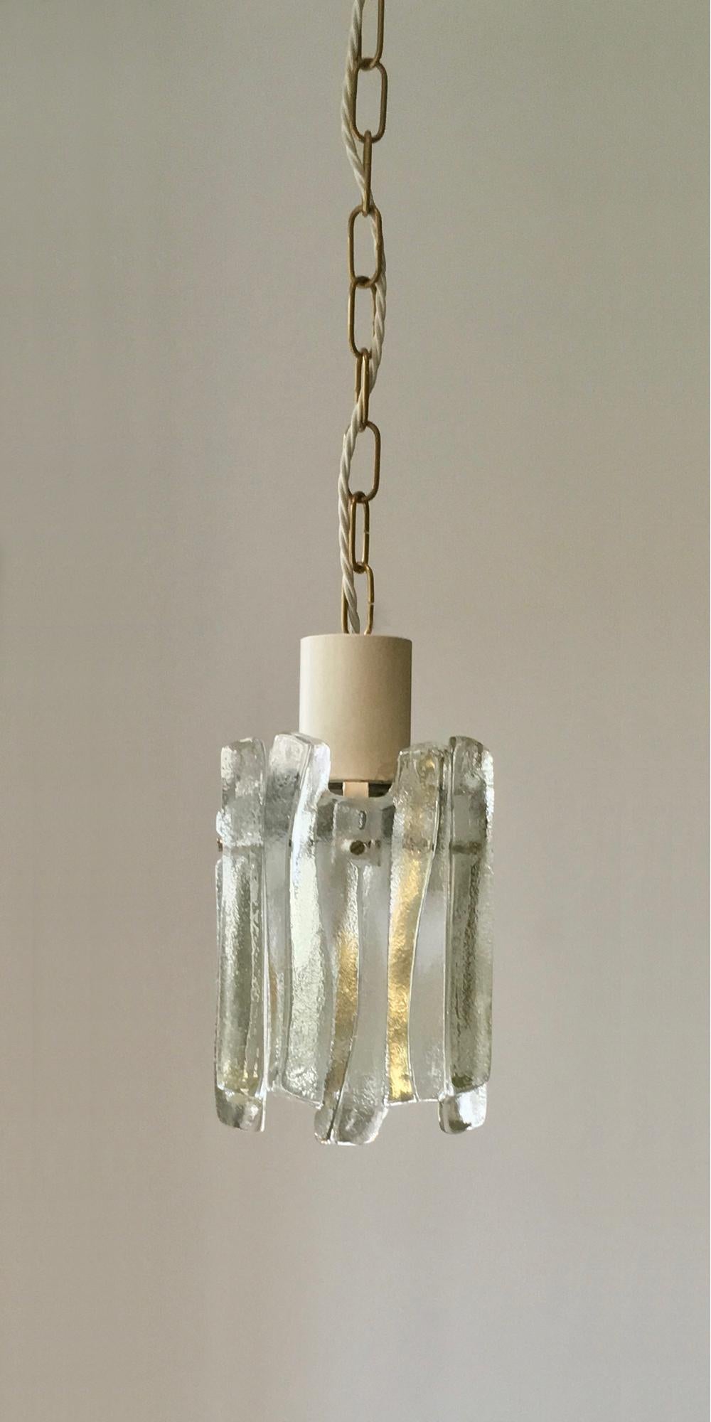 *** Please contact us if you would like details of availability of this item. ***

A pair of glass pendant lights by Kalmar of Austria, late 1960s or early 1970s design. Two pairs available; price per pair.

Simple but stylish lights giving a nice