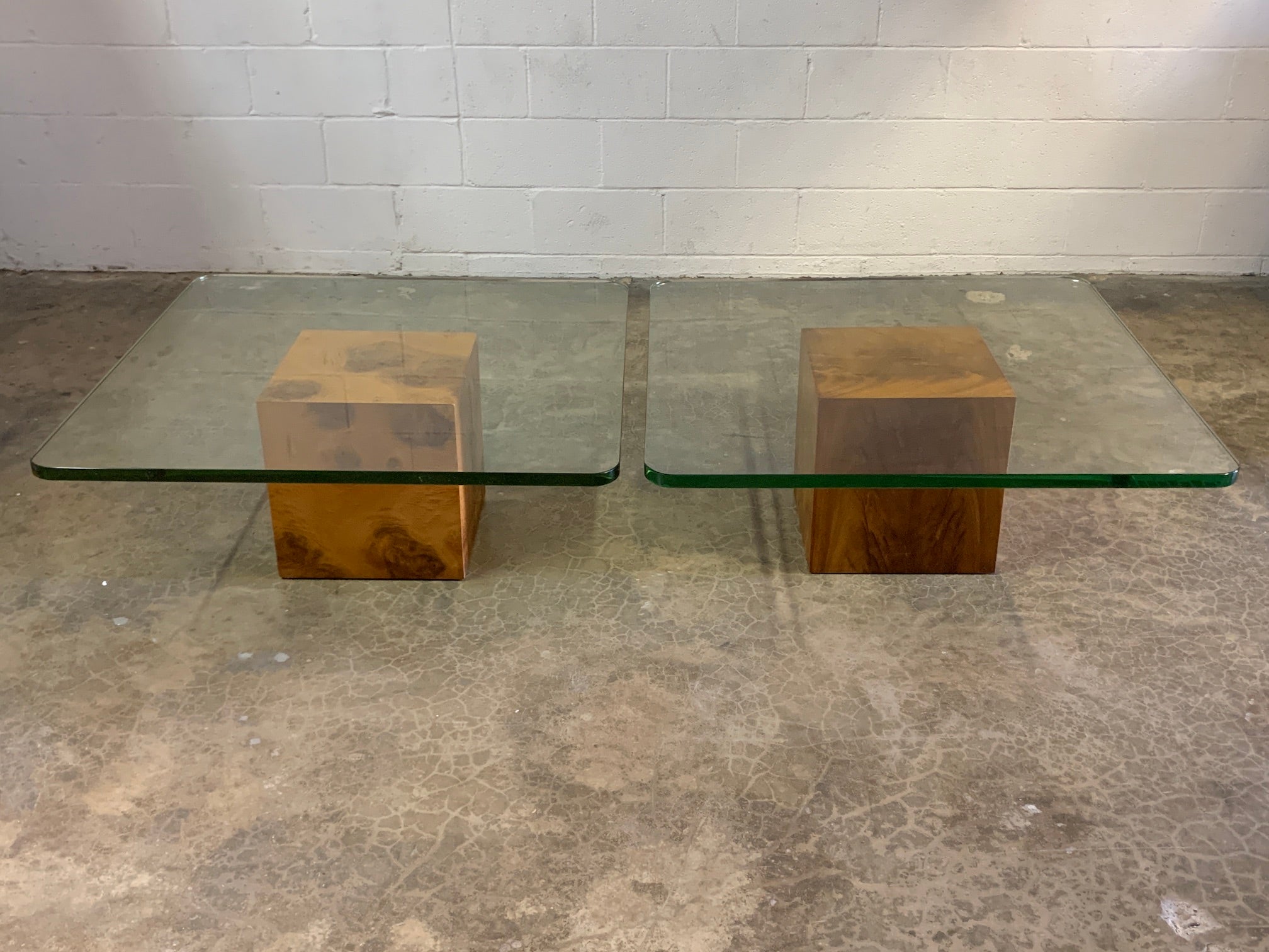 A pair of cube coffee tables with original one inch thick green glass tops. Designed by Edward Wormley for Dunbar.