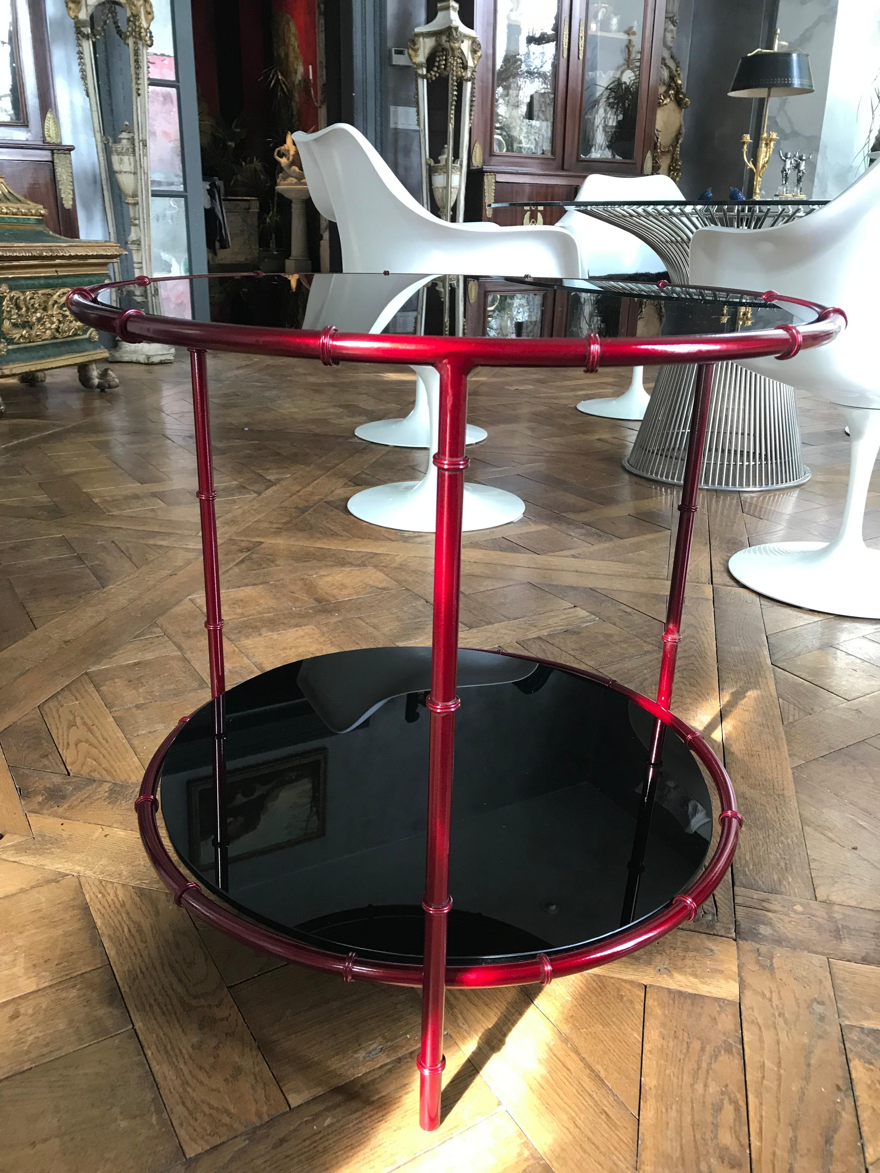 This beautiful Pair of Asian inspired solid bronze frame faux bamboo side tables is powder coated in a deep red color.
The finish is baked on at 400 degrees which makes the color chip resistant and able to be used indoors or outdoors.
The two