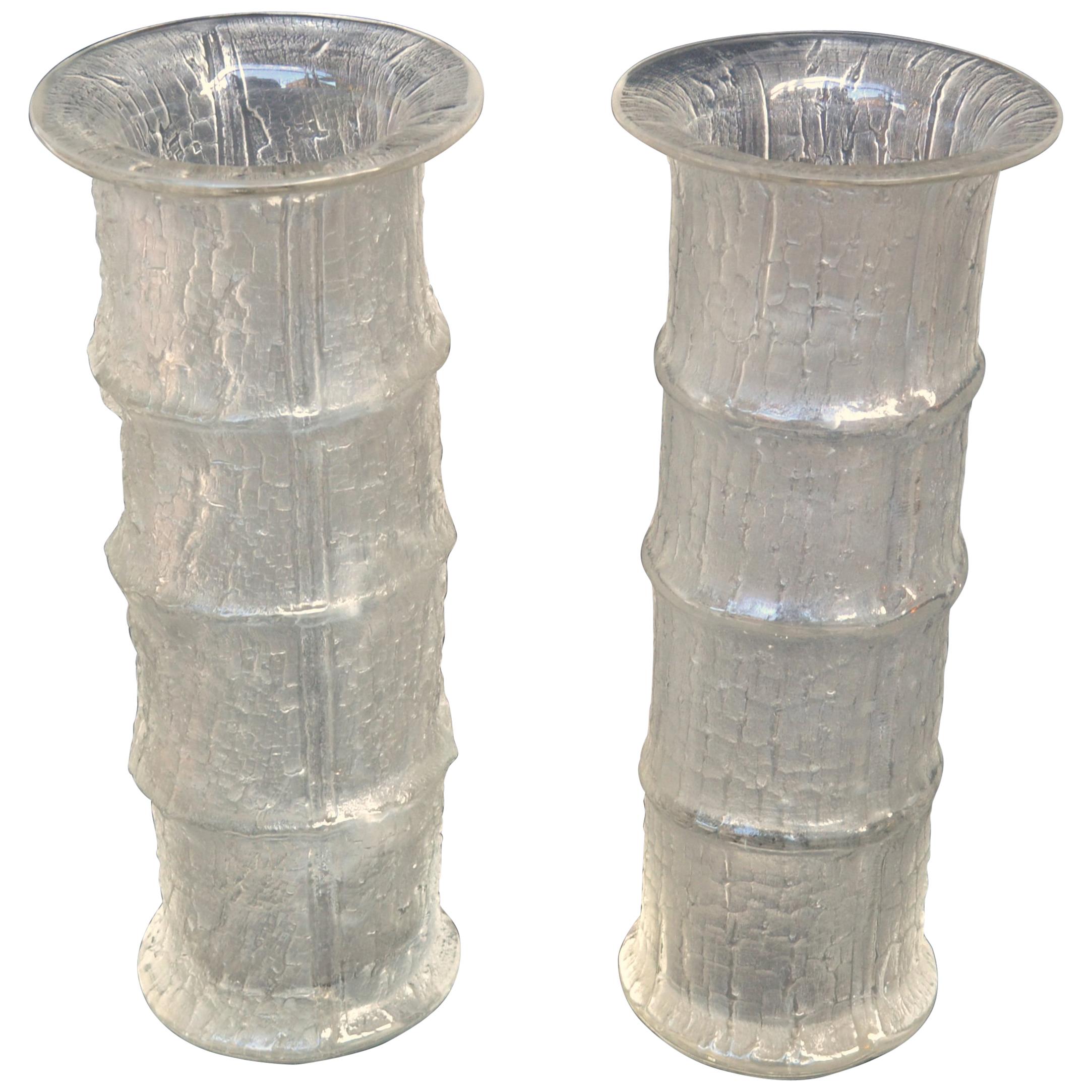 A pair of hand blown glass vases designed in 1964 by Timo Sarpaneva (1926-2006) for Iittala, Finland. Textured glass outside with a bamboo design is achieved by mold-blown technique creating a contrast of smooth glass on the inside and iced glass on