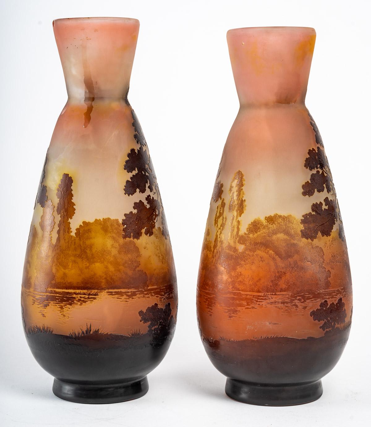 Pair of glass vases by Gallé, early XXth century.
A pair of Gallé glass vases with lake and forest decorations, very nice colour, early 20th century.
Measures: H: 32 cm, D: 14 cm
ref 3272