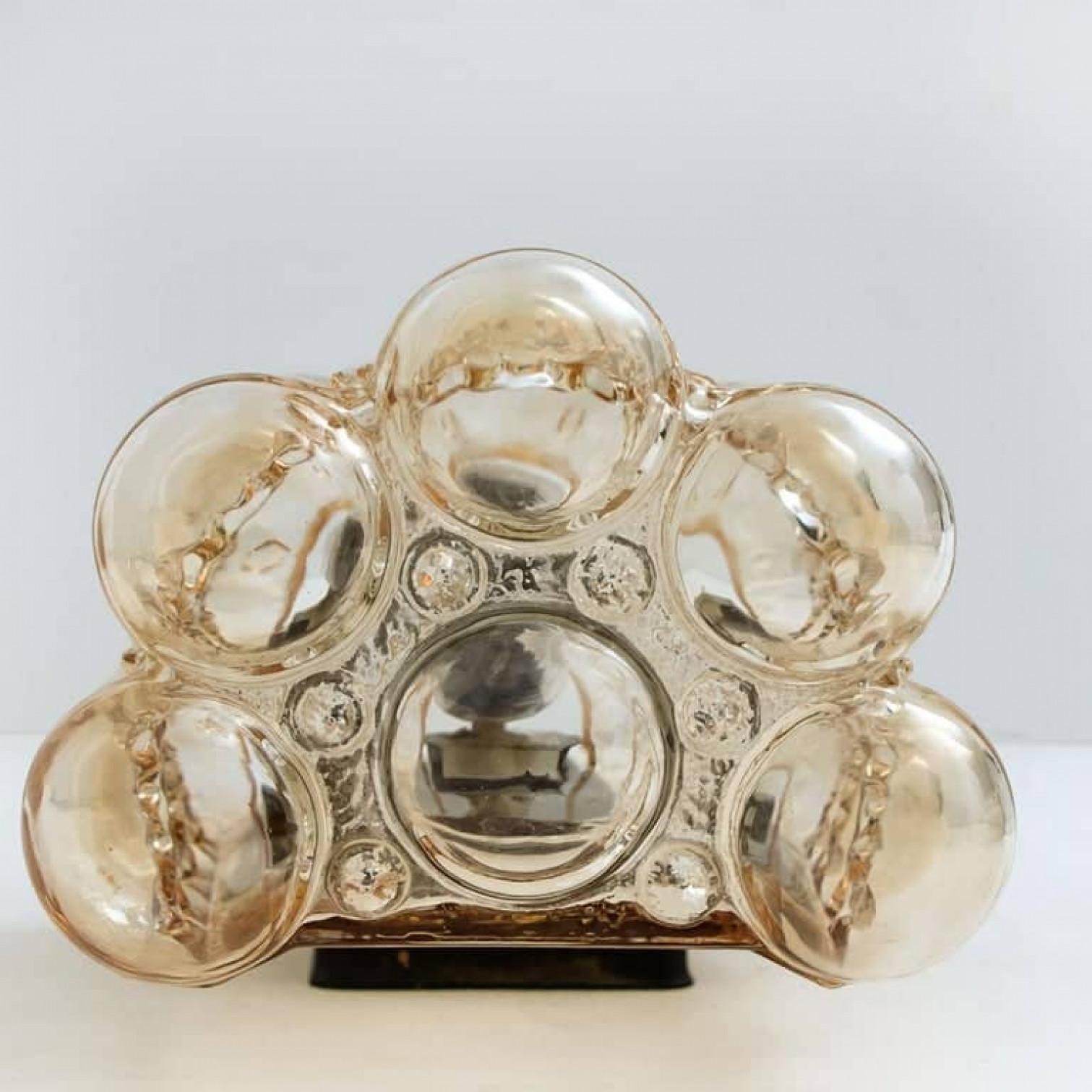 A rare and stunning pair of beautiful bubble glass wall lights designed by Helena Tynell for Glashütte Limburg. A design Classic, the amber colored or toned of the hand blown glass gives a wonderful and warm glow.

Notice the price is for the