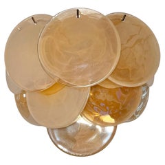 Pair of glass wall sconces - 10 iridescent alabaster gold discs