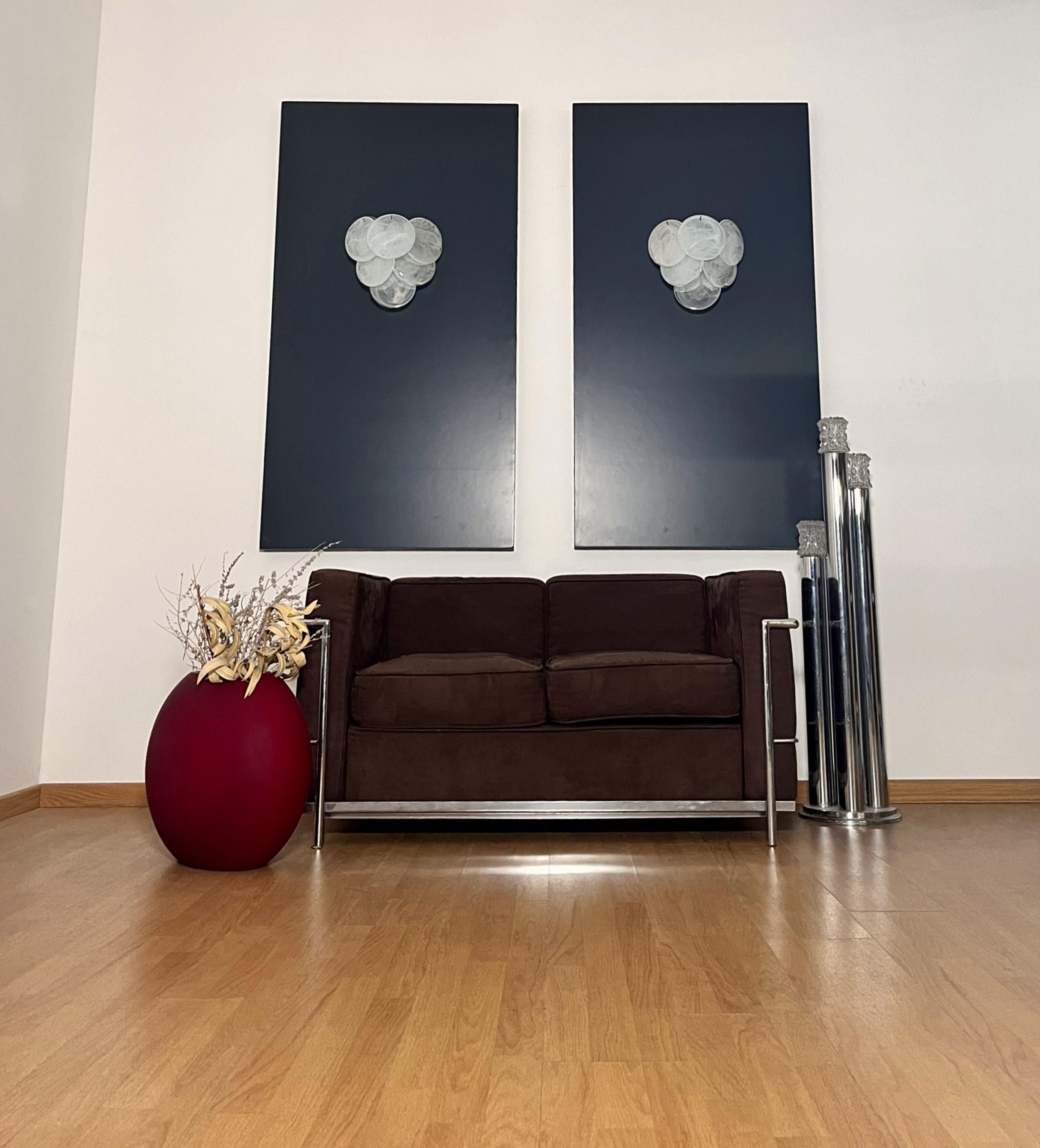 Pair of Vintage Italian Murano appliques in Vistosi style. Wall lights have 6 glass for each, white alabaster glasses. Nickel metal frame.
Period: 	late 20th century
Dimensions: 11.80 inches (30 cm) height; 11.80 inches (30 cm) width; 6.20 inches