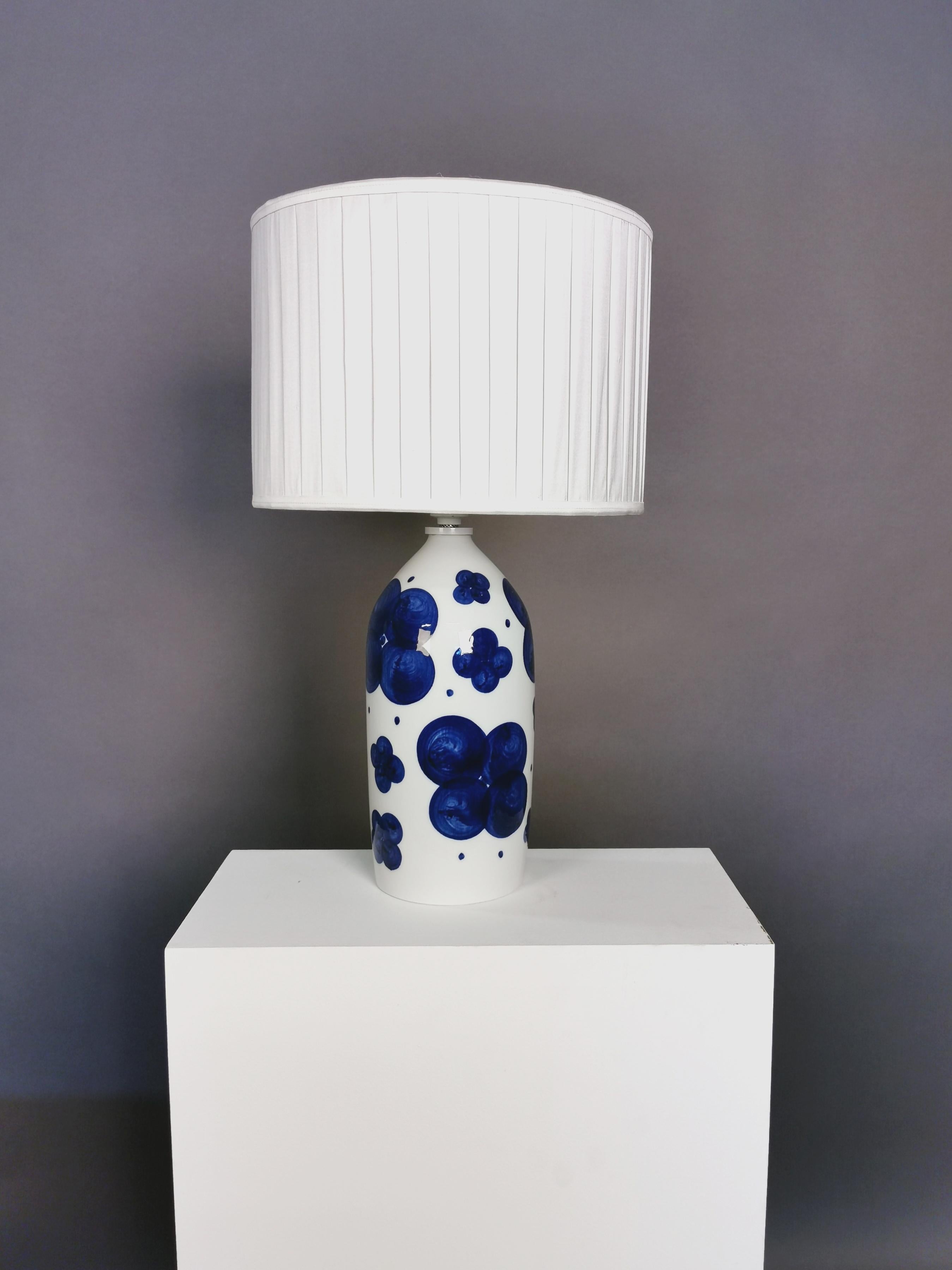 A pair of glazed ceramic table lamps by Swedish artist Sylvia Leuchovius.
New handmade plissé shades in silk with top diffuser. Rewired.
Manufactured by Rörstrand.
Signed.
Measures: 40cm high without the shades.
 
