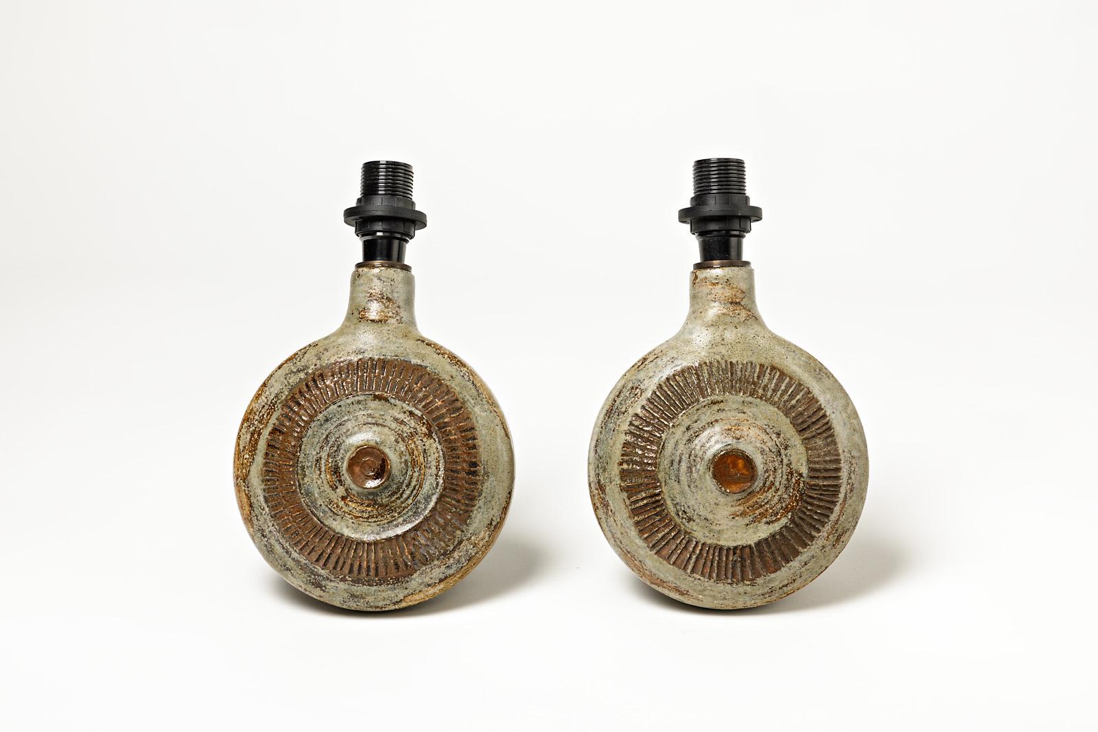 French Pair of glazed ceramic wall lamps, green and brown by Robert Héraud, circa 1960. For Sale