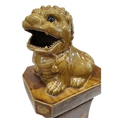 Pair of Glazed Ochre Foo Dogs on Pedestals