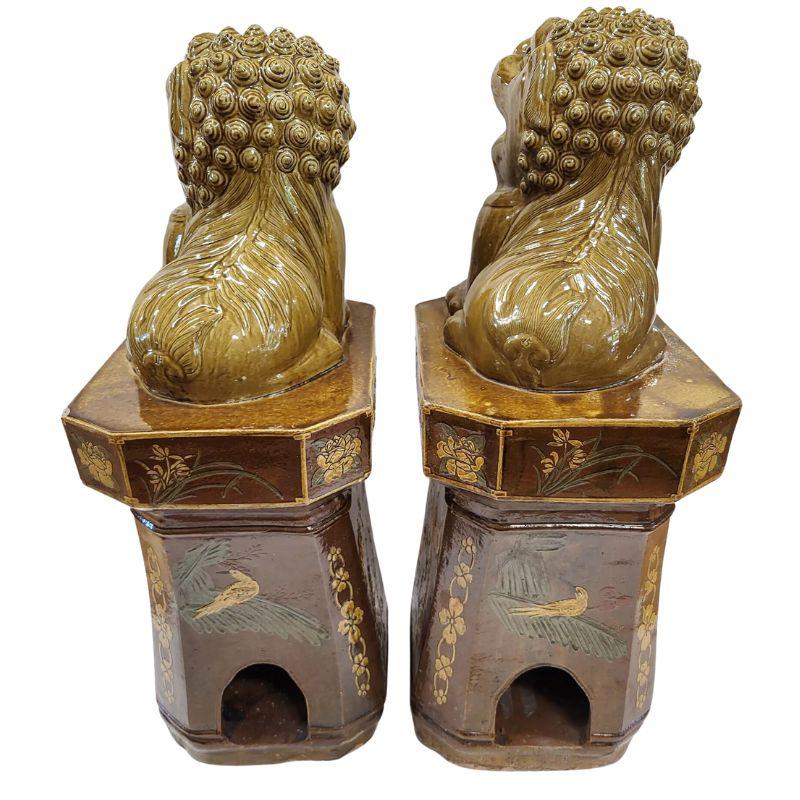20th Century Pair of Glazed Ochre Foo Dogs on Pedestals For Sale