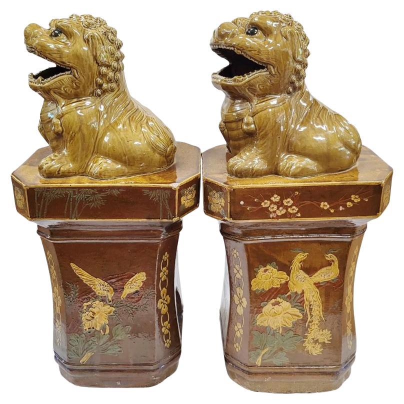 Pair of Glazed Ochre Foo Dogs on Pedestals For Sale