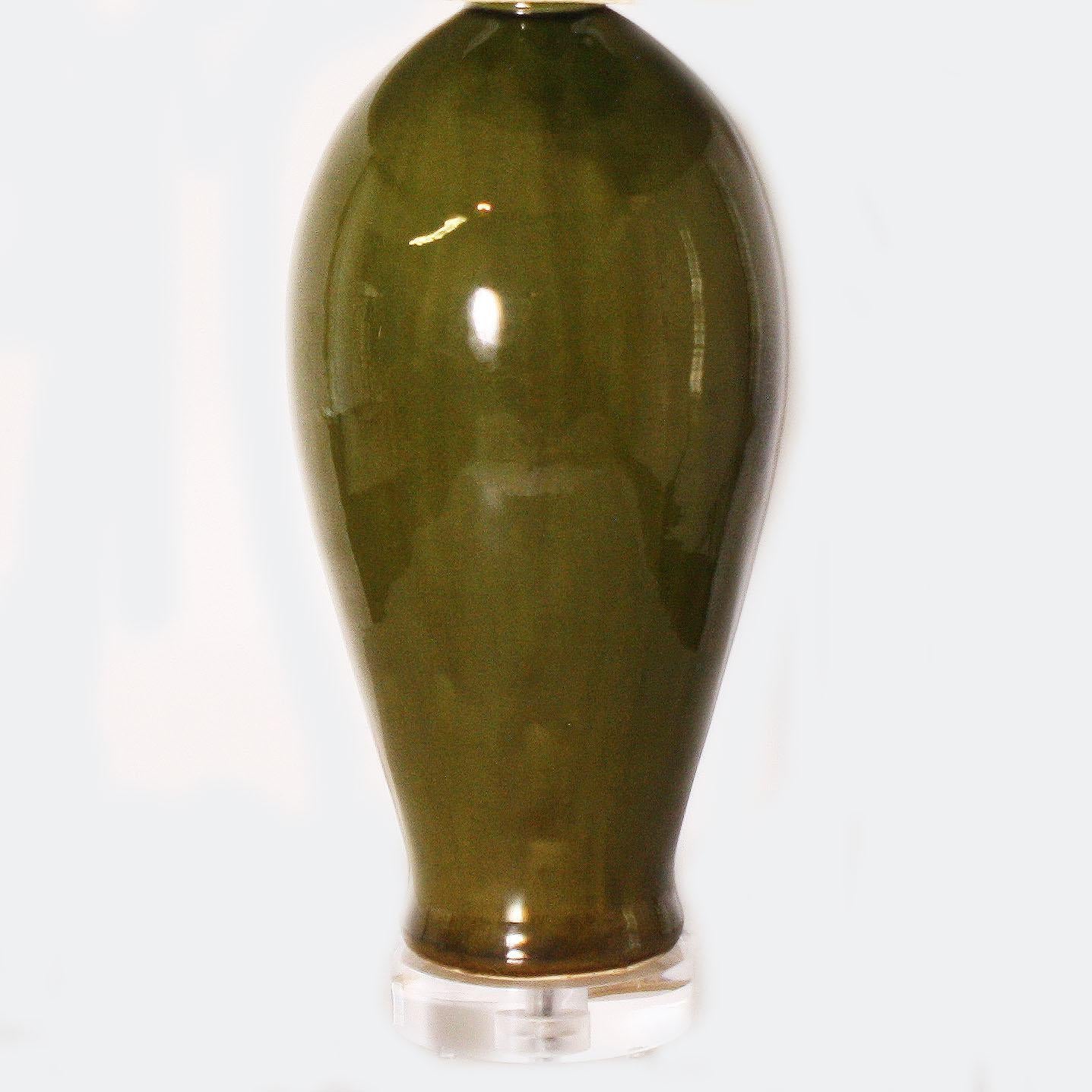 Pair of glazed olive green ceramic lamps, circa 1960
$2900