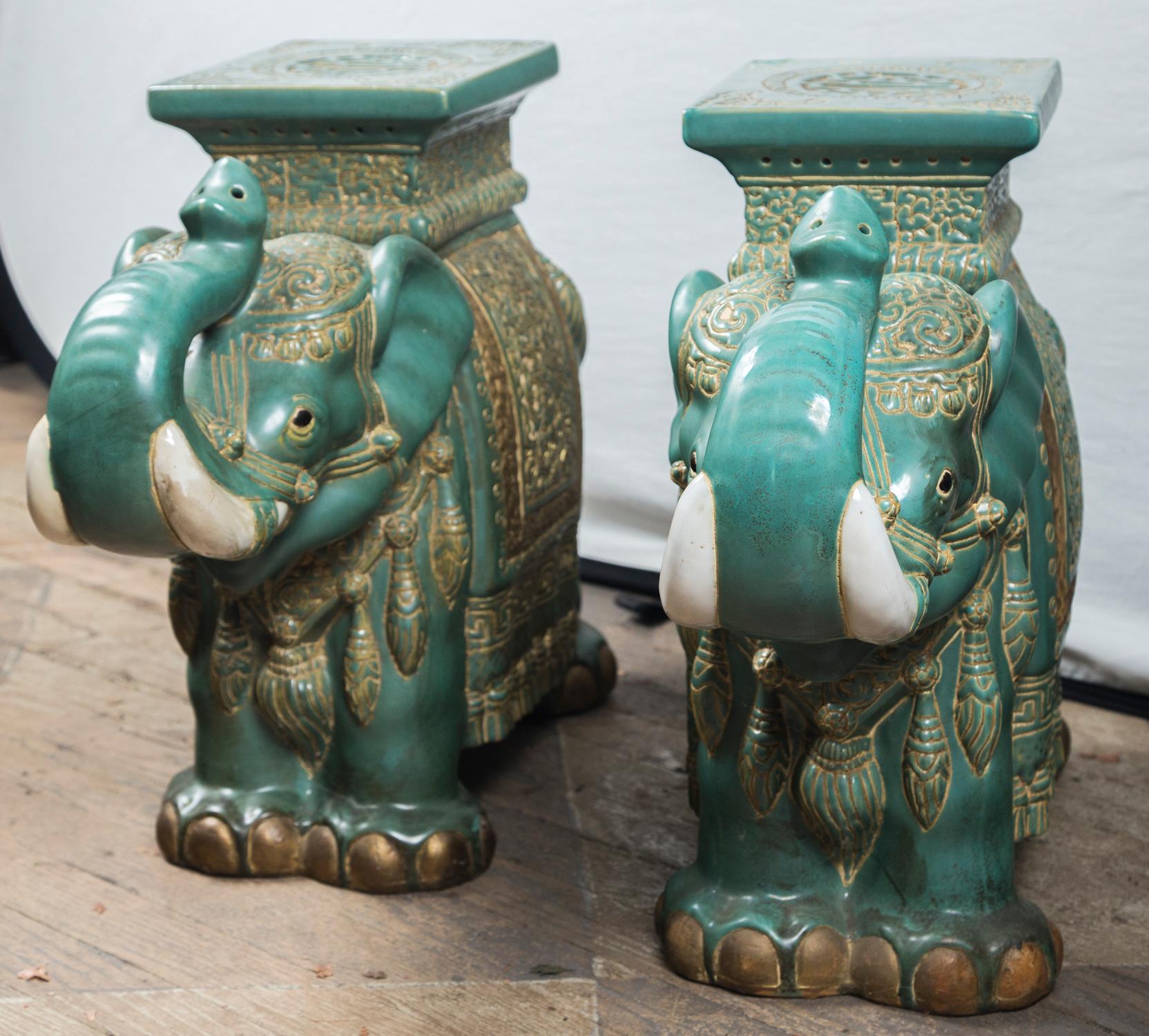 Each with a top flat surface measuring 8.25 x 7.25
Blue green glazed incised with decorative elements. White tusks.
The elephants with their trunks up.
Gold paint to simulate gilded mounts.