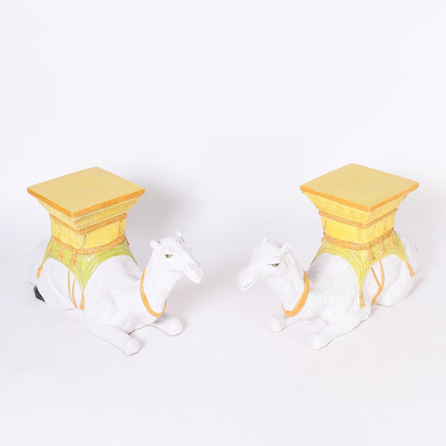 Vintage whimsical stands crafted in terra cotta glazed and decorated with traditional mediterranean colors depicting service camels in repose.
