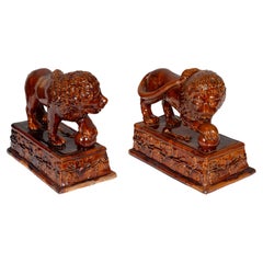 Pair of Glazed Terracotta Figures of Lions
