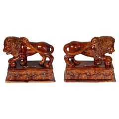 Pair of Glazed Terracotta Figures of Lions