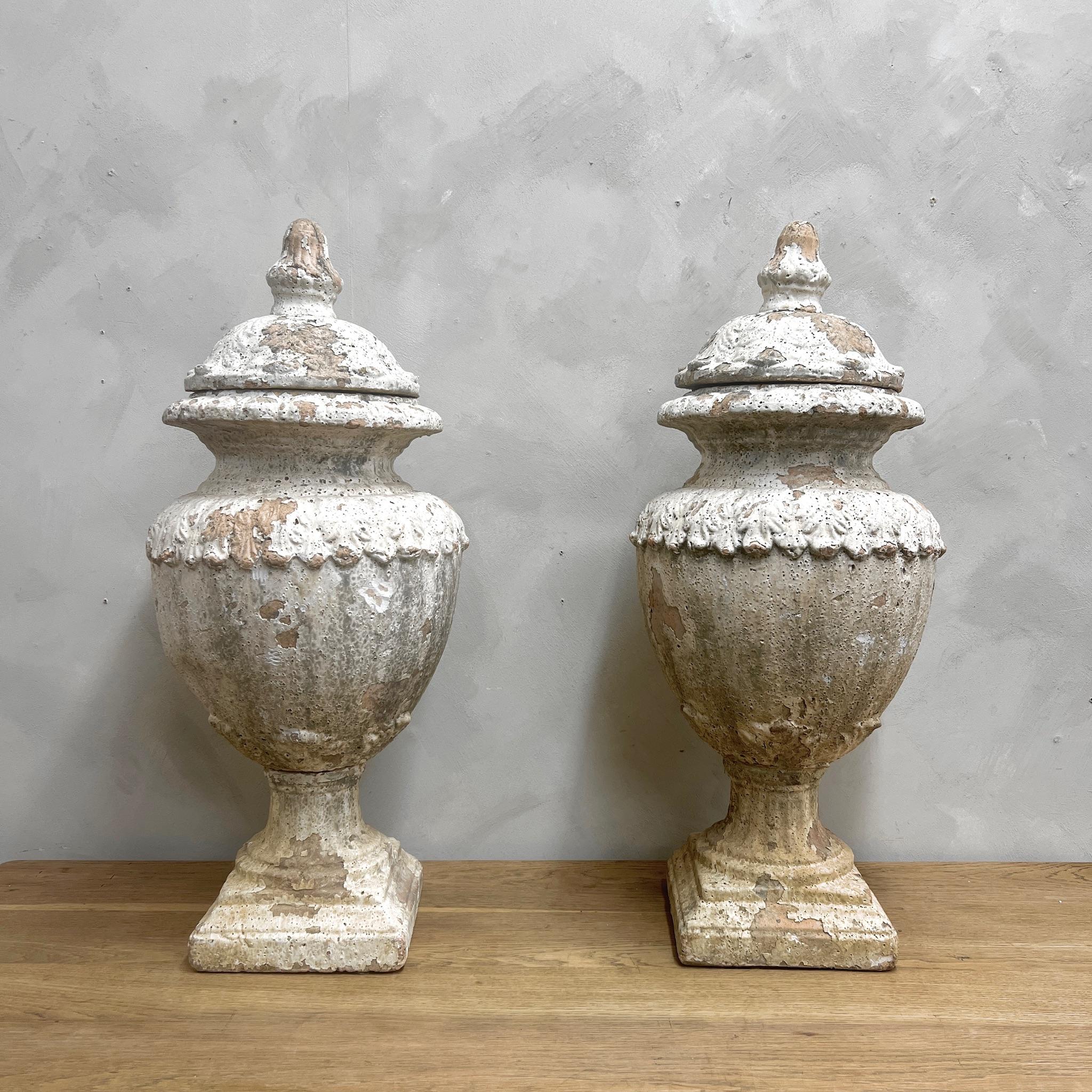 A wonderful pair of glazed terracotta, Lidded Urns.
With just the right amount of weathering.
Clean enough for indoor use.
Would look amazing in any setting 

England, early to mid 20th Century.

Please message if any further info or photos are