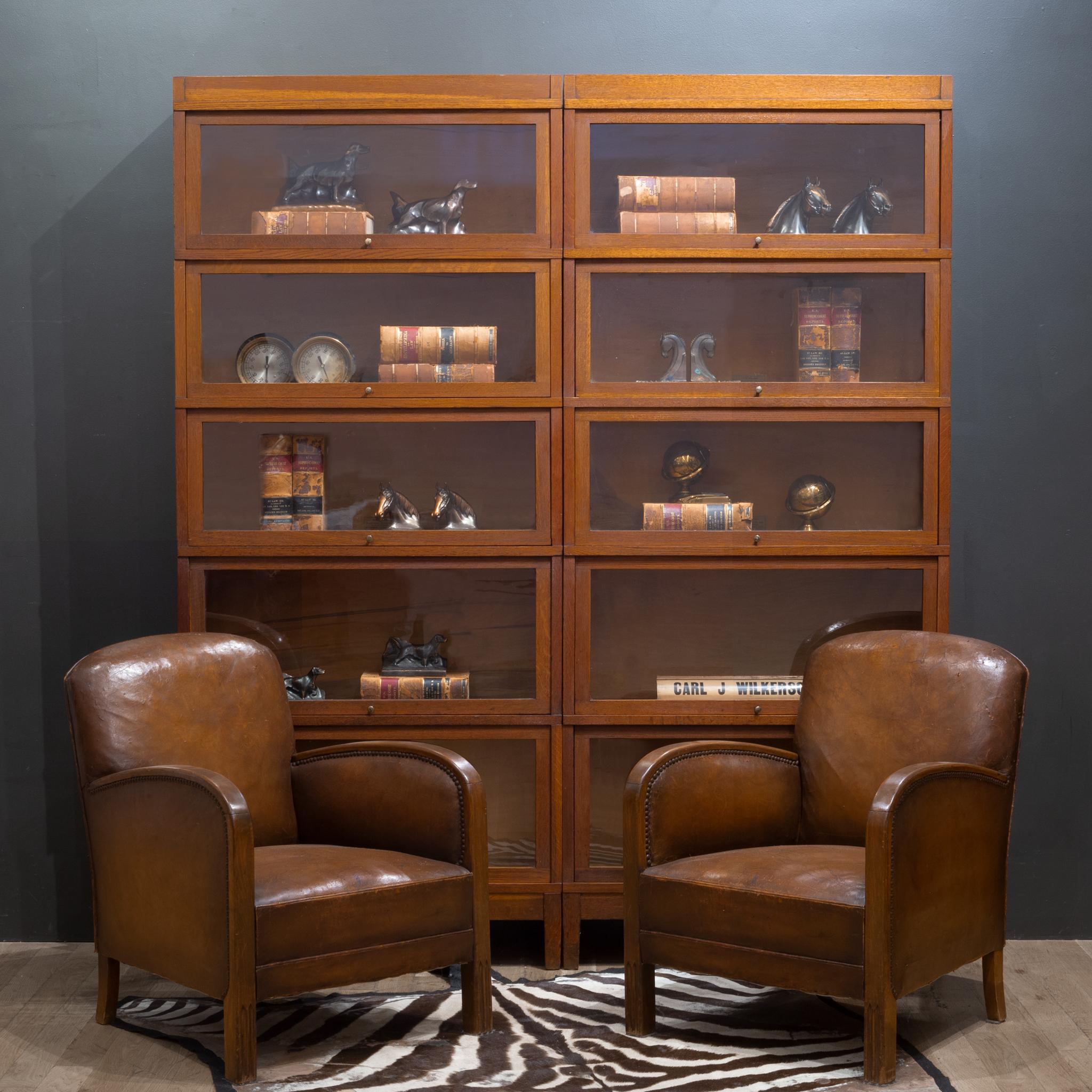 About

Price is per bookcase.

Original matching early 20th century modular 5 stack oak lawyer's bookcases with brass knobs and glass doors that open and slide in from the top. Each bookcase is modular consisting of 7 pieces: the top, the bottom and