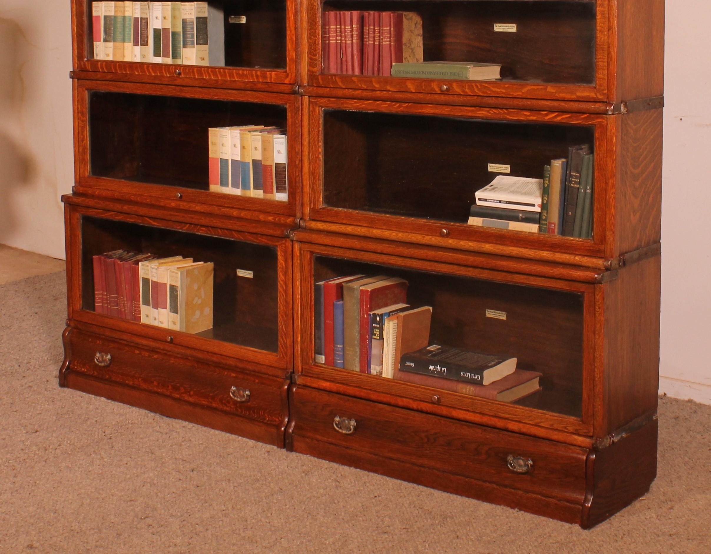 British Pair Of Globe Wernicke Oak Bookcases Circa 1900 For Sale